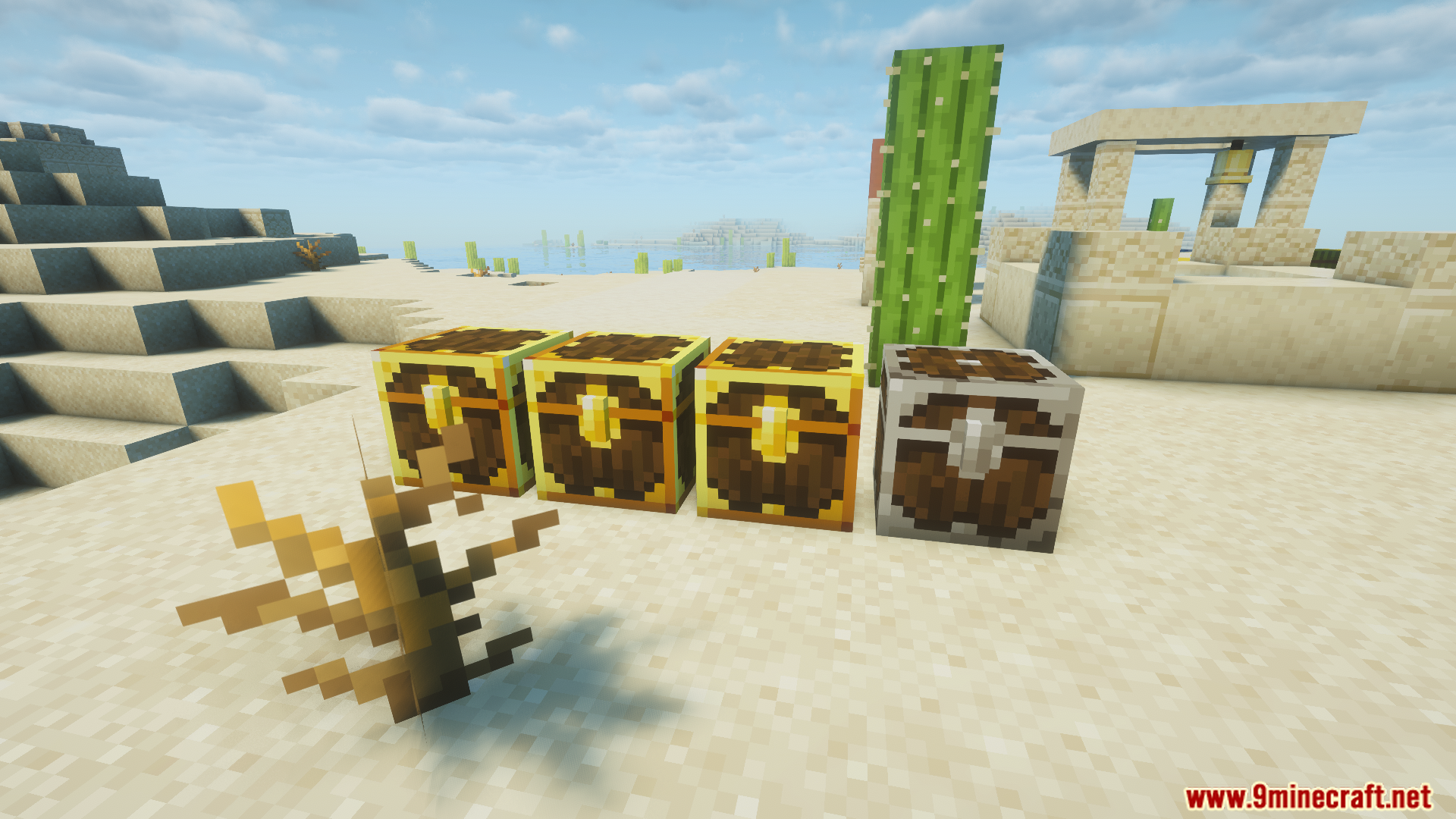 Three golden chests and one silver chest on sand