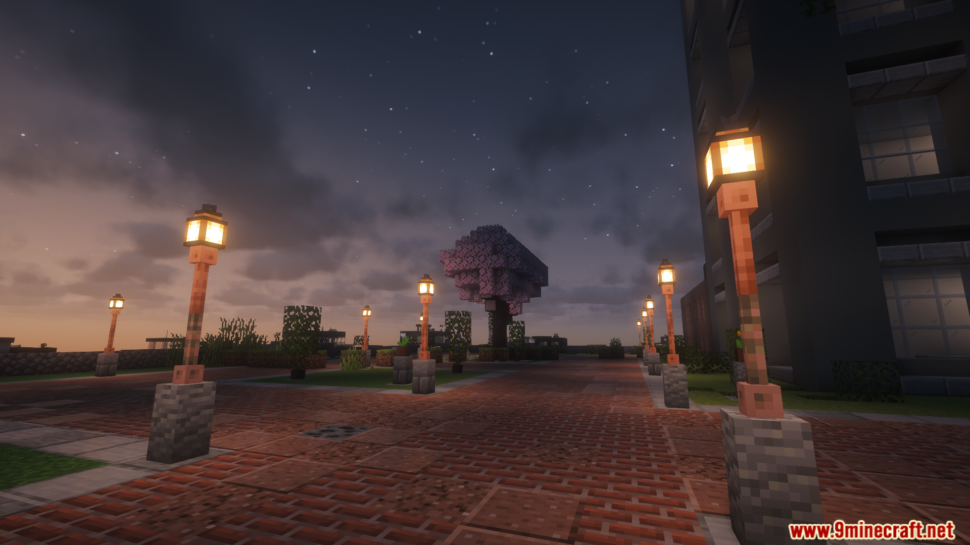 A city park at night with glowing lampposts