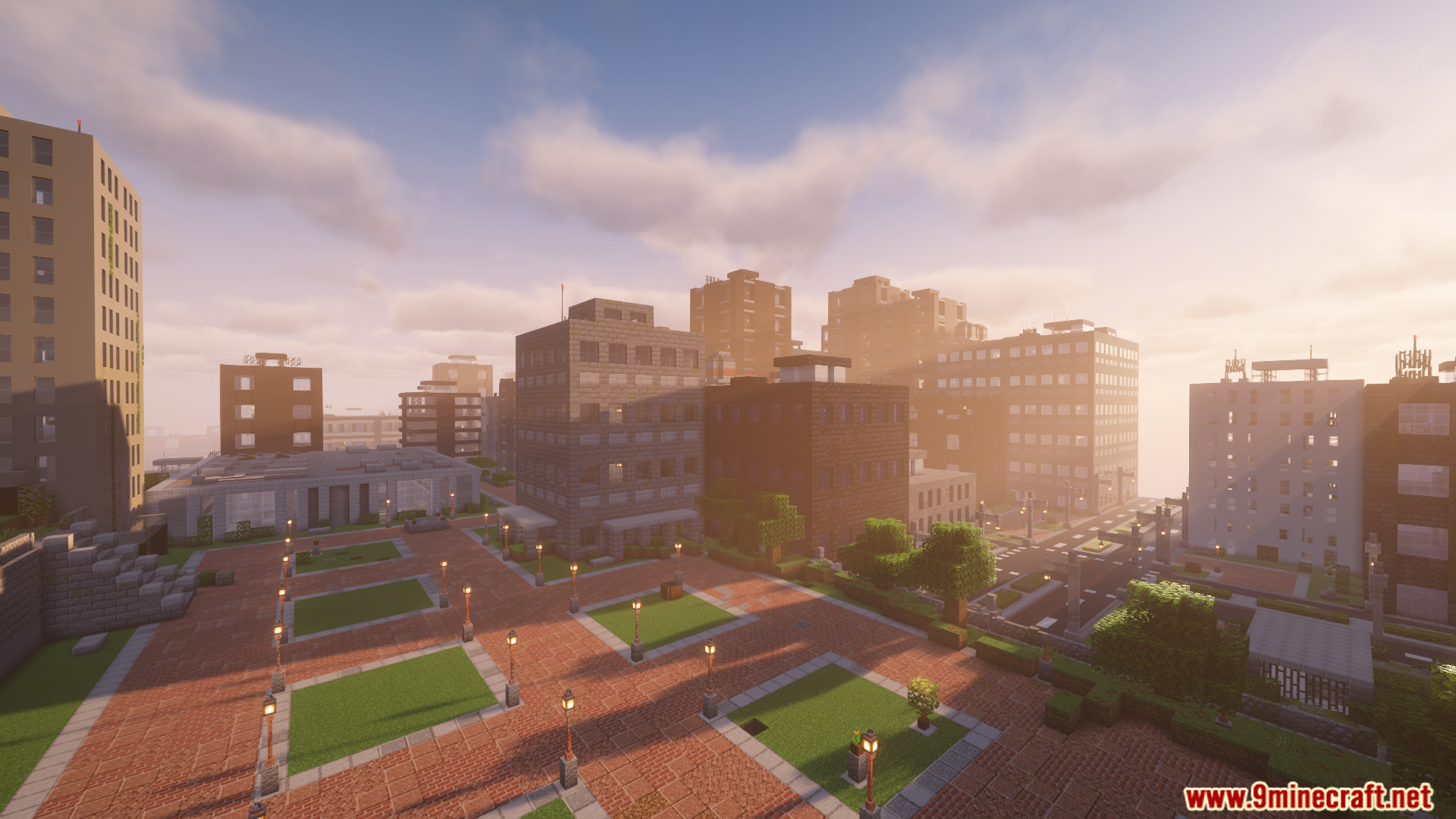 A sprawling modern city with tall buildings at sunrise