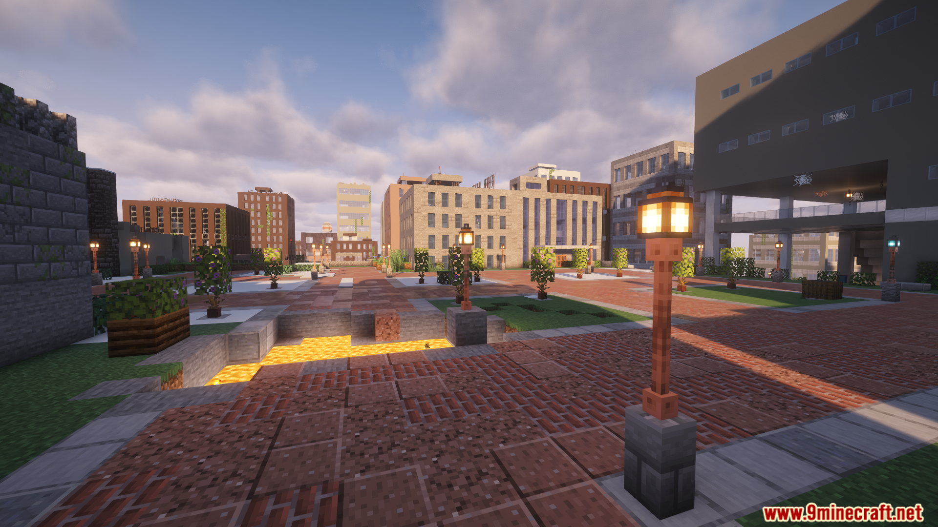 A modern city plaza with brick walkways and streetlights
