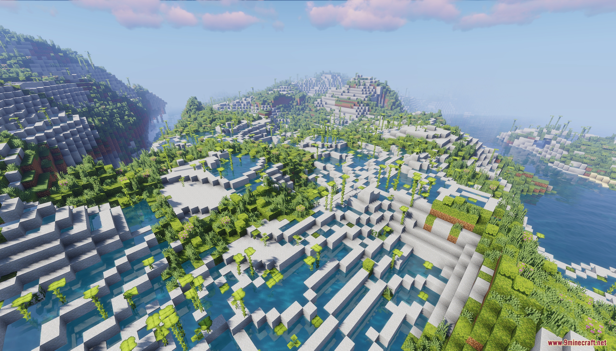 Vast terraced landscape with lush greenery and water pools