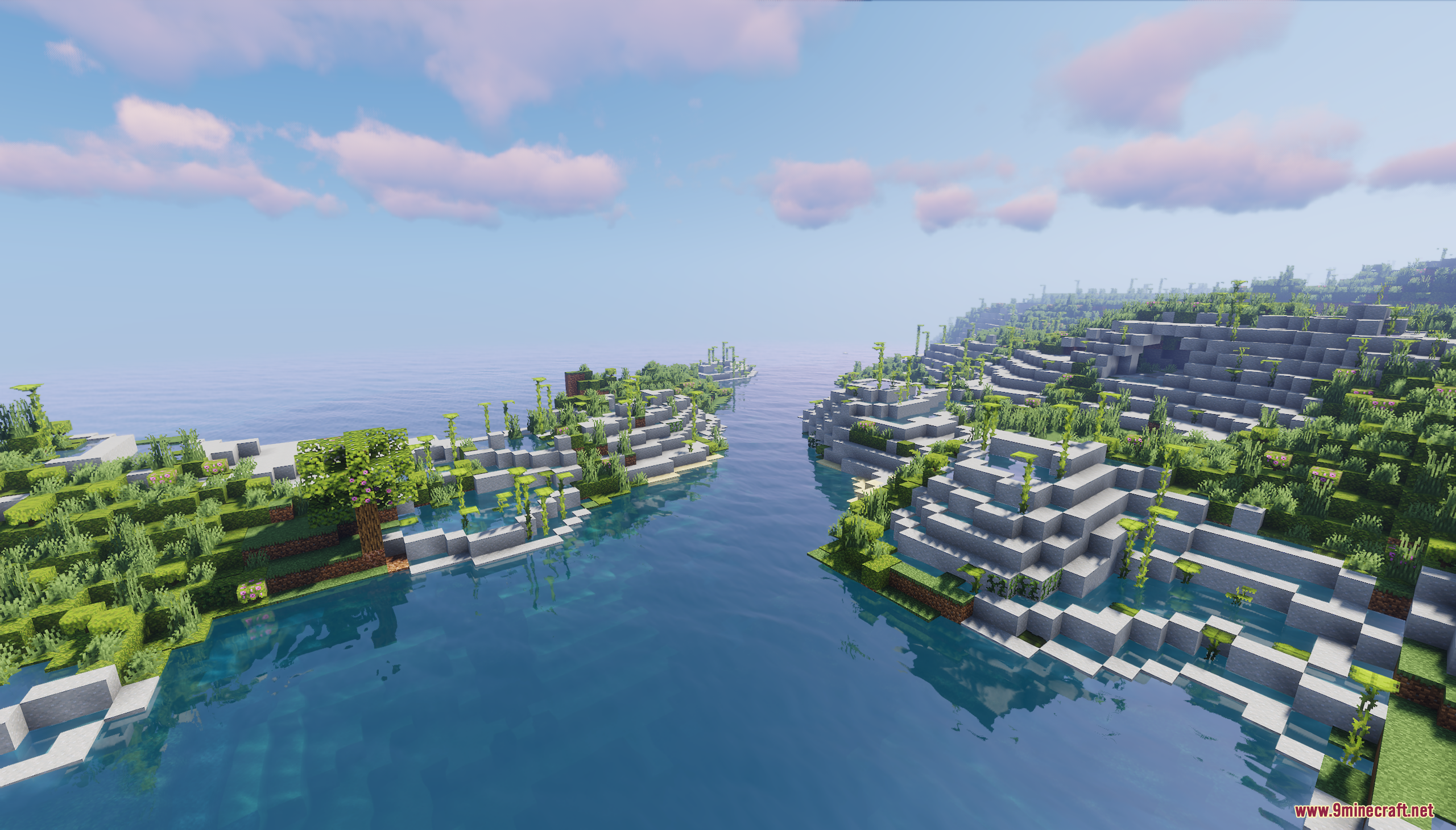 A clear blue river flowing between two lush islands