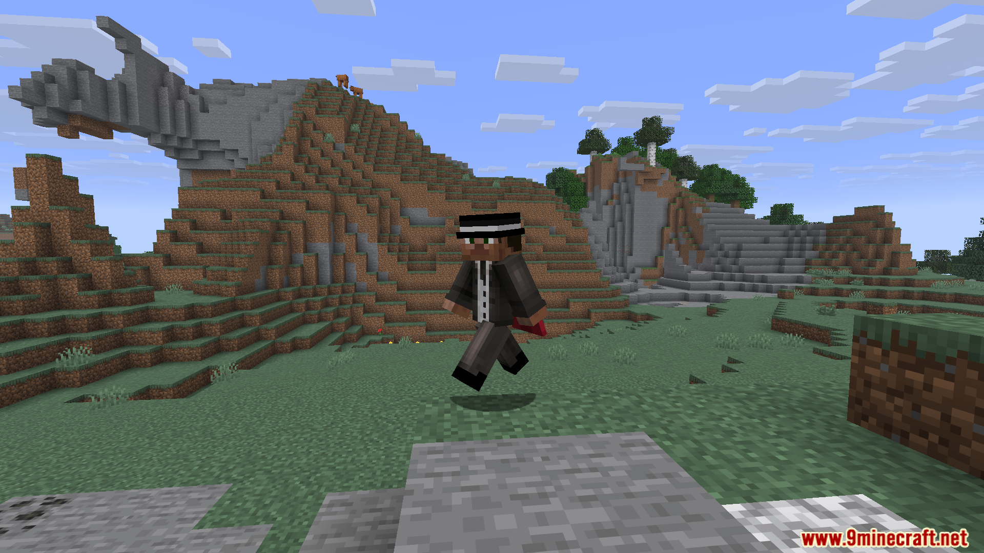 A player in a suit and fedora jumps mid-air