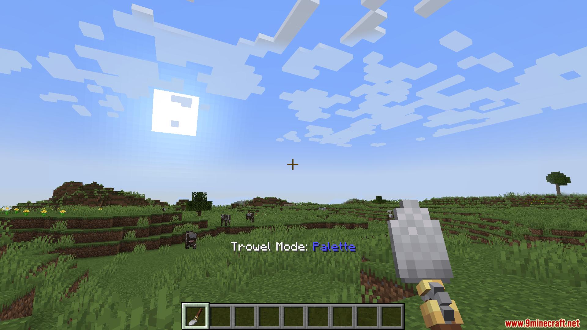 Player holding Mech Trowel in Palette mode in grassy field