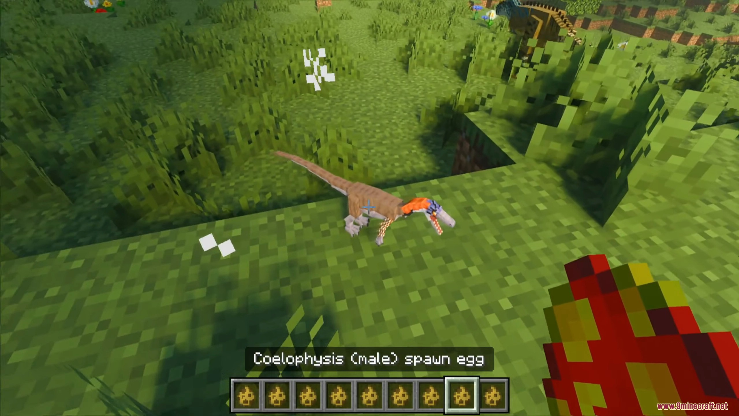 Player using a spawn egg to hatch small prehistoric dinosaur species