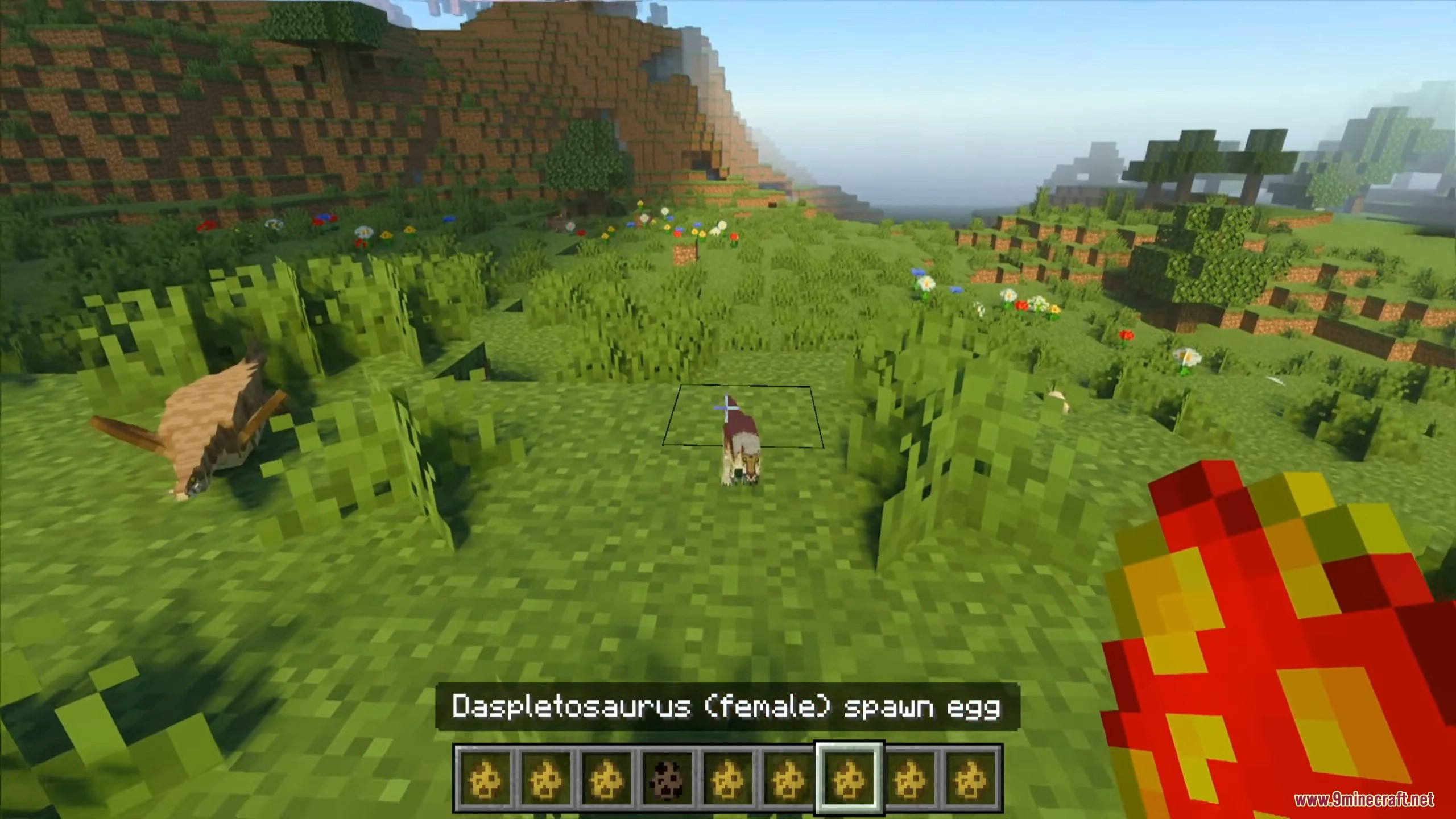 Player holding a spawn egg to hatch baby dinosaur species