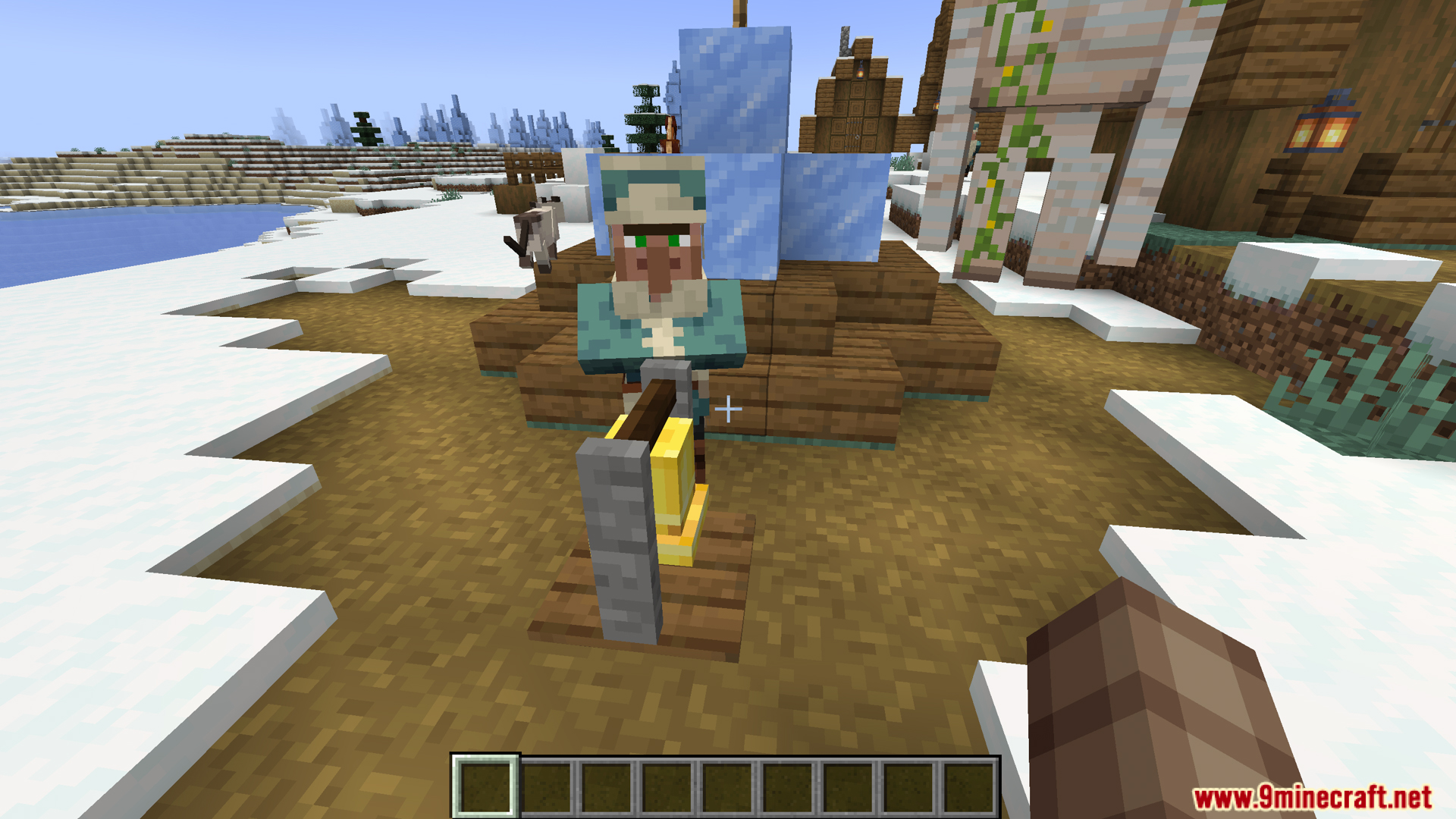 A villager works at a grindstone in a snowy biome