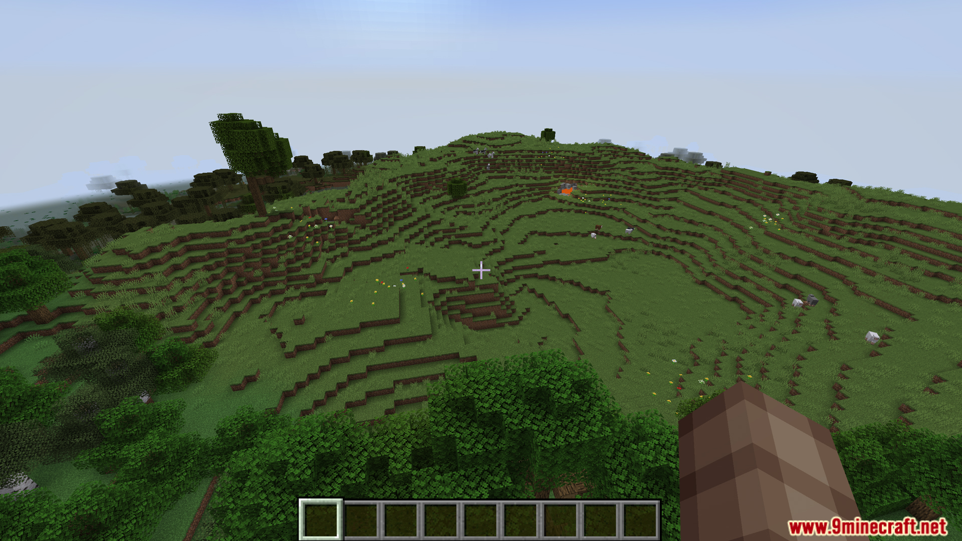 Player looking over a grassy landscape