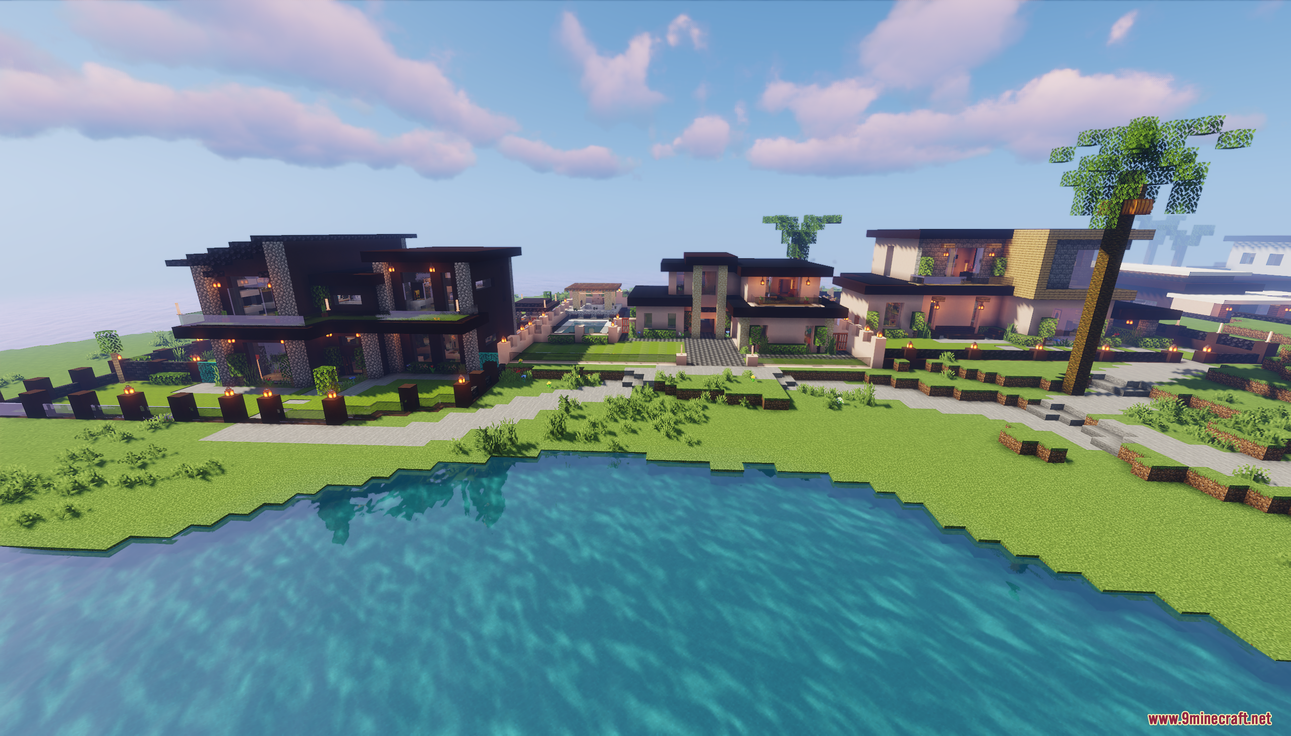 Row of modern luxury houses with large windows near the water