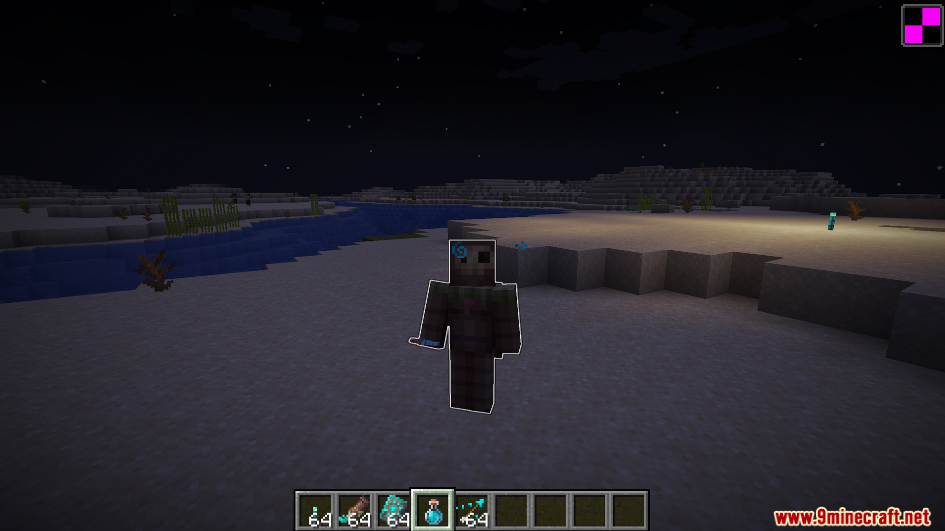 Player wearing armor with glowing blue trim at night