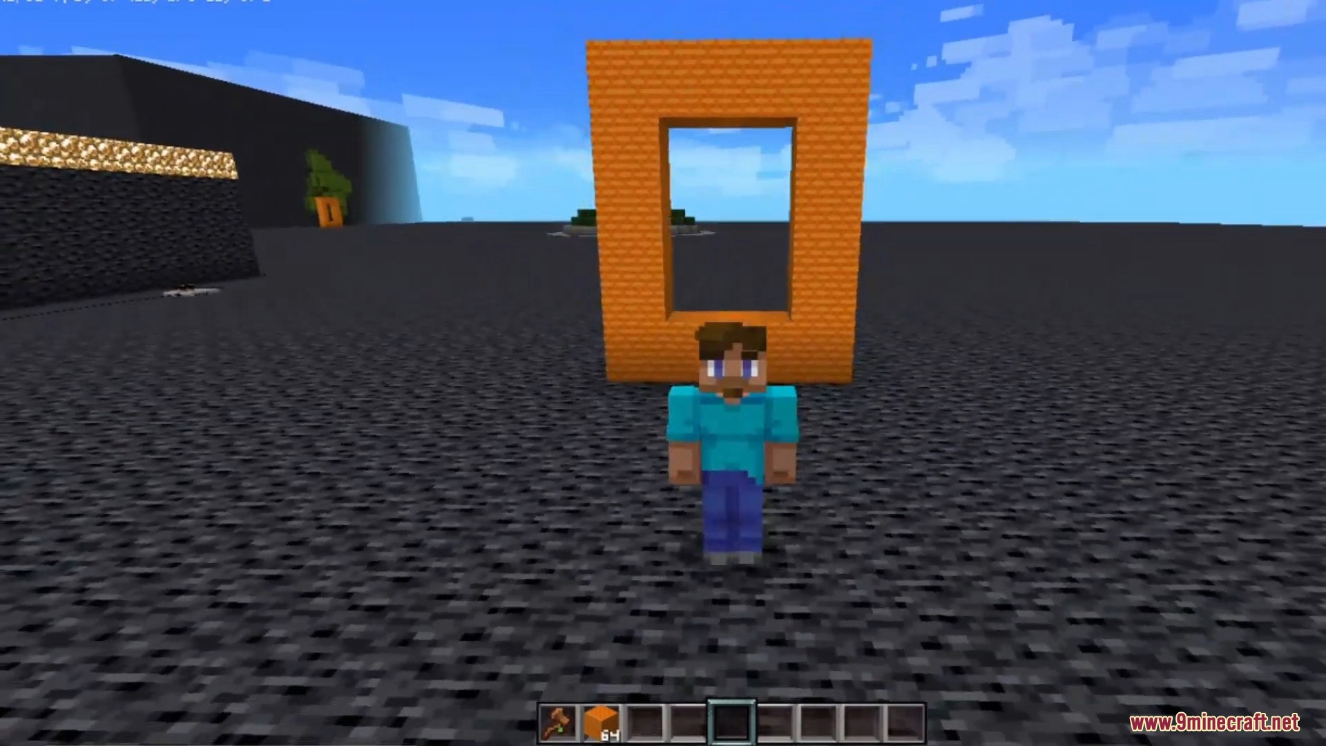 Player standing in front of a custom orange block portal frame