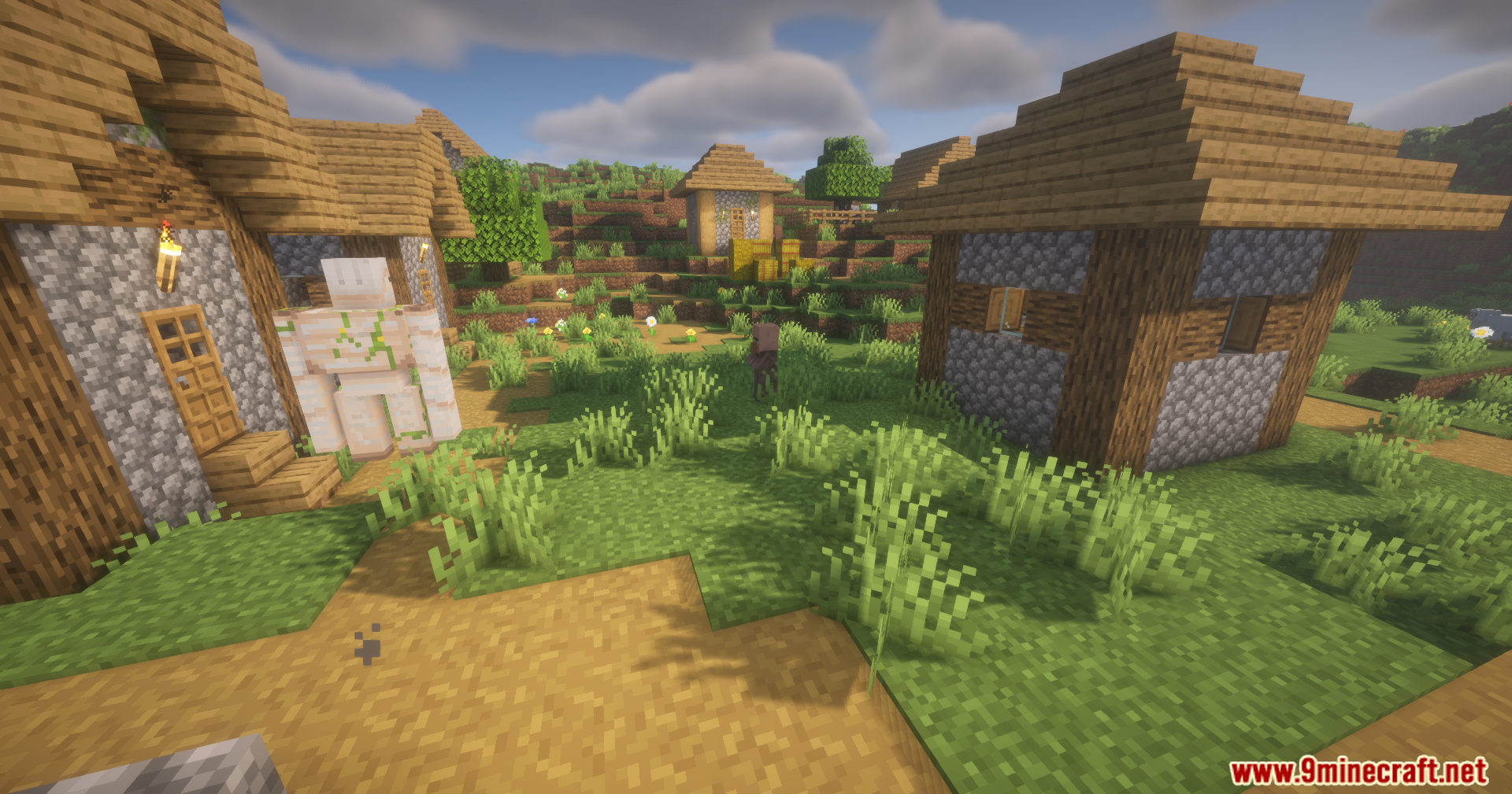 Iron golem standing near houses in a sunny Minecraft village