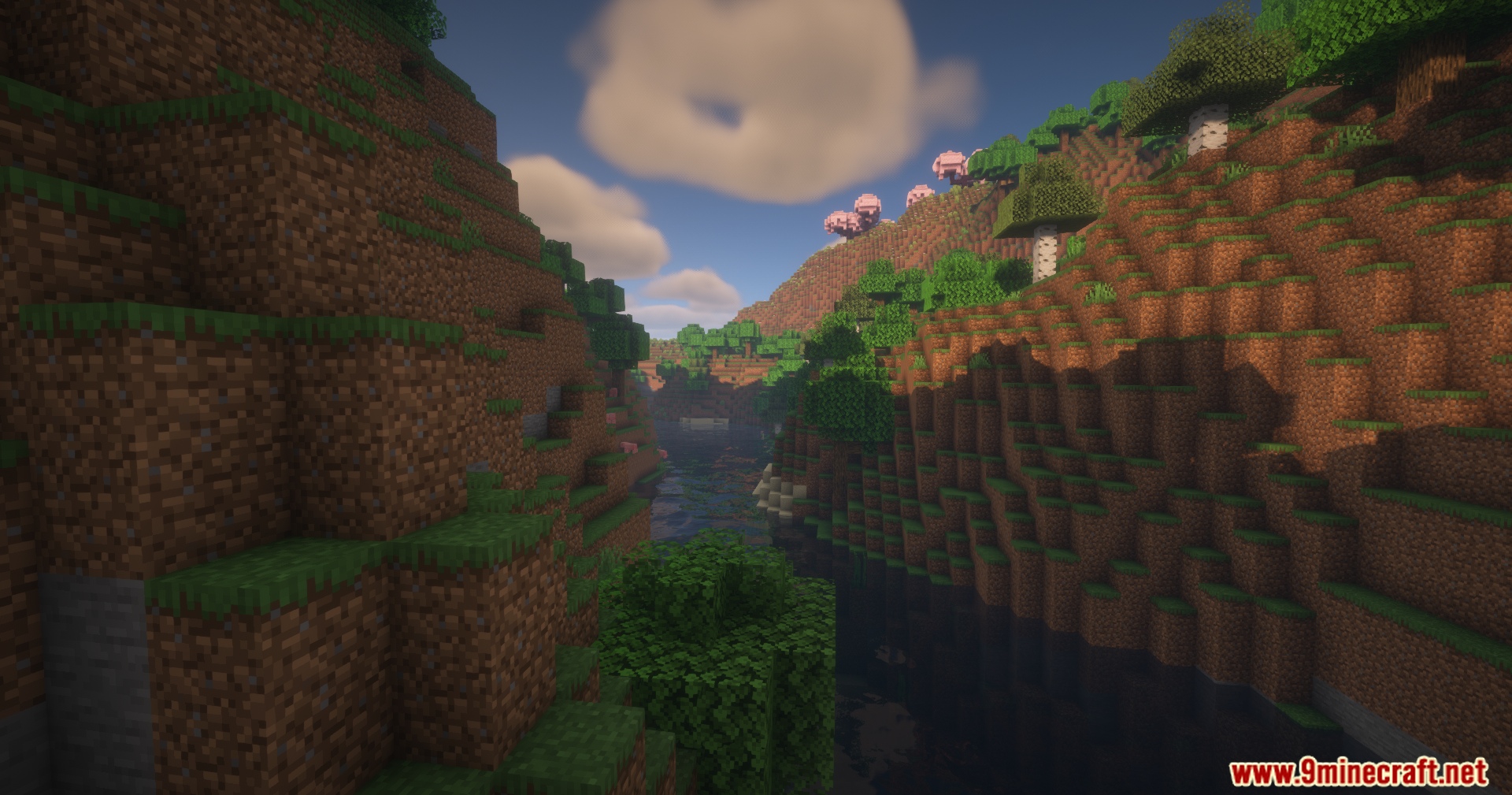 River valley with steep hills and cherry trees in the distance