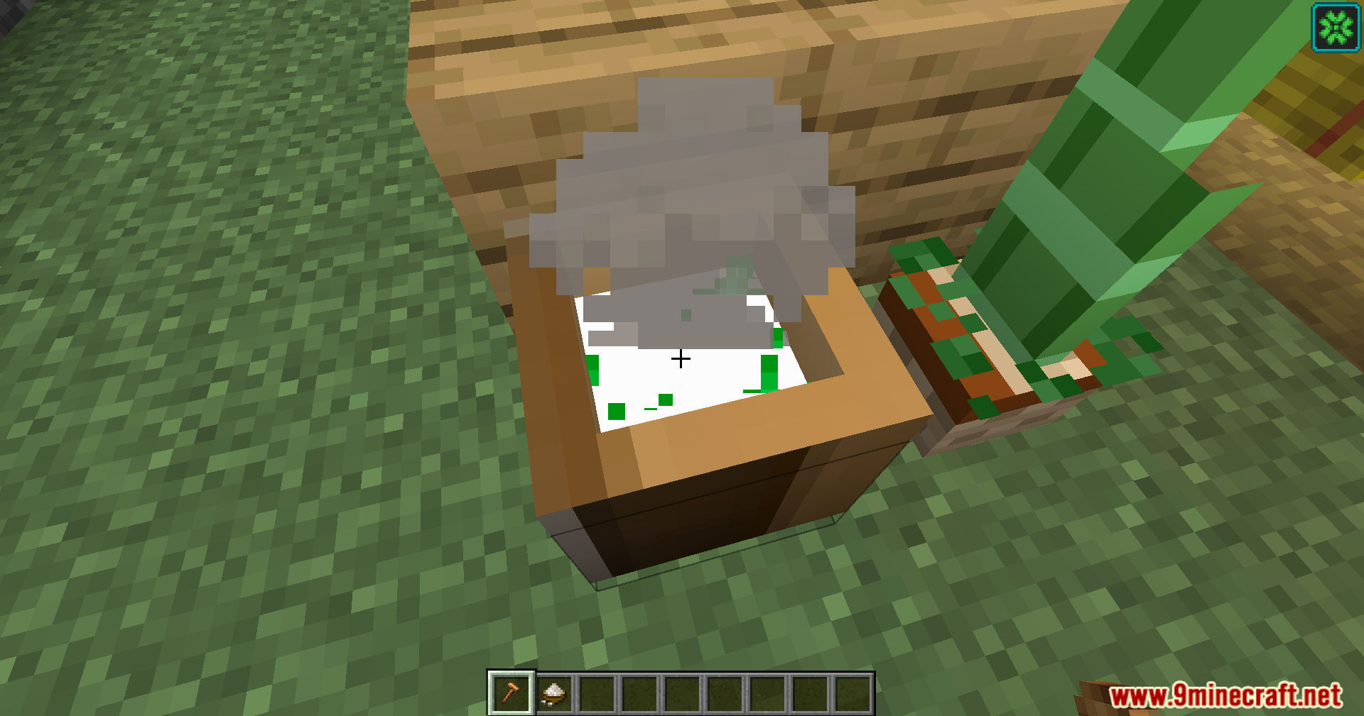 Steaming rice being prepared in a wooden mortar