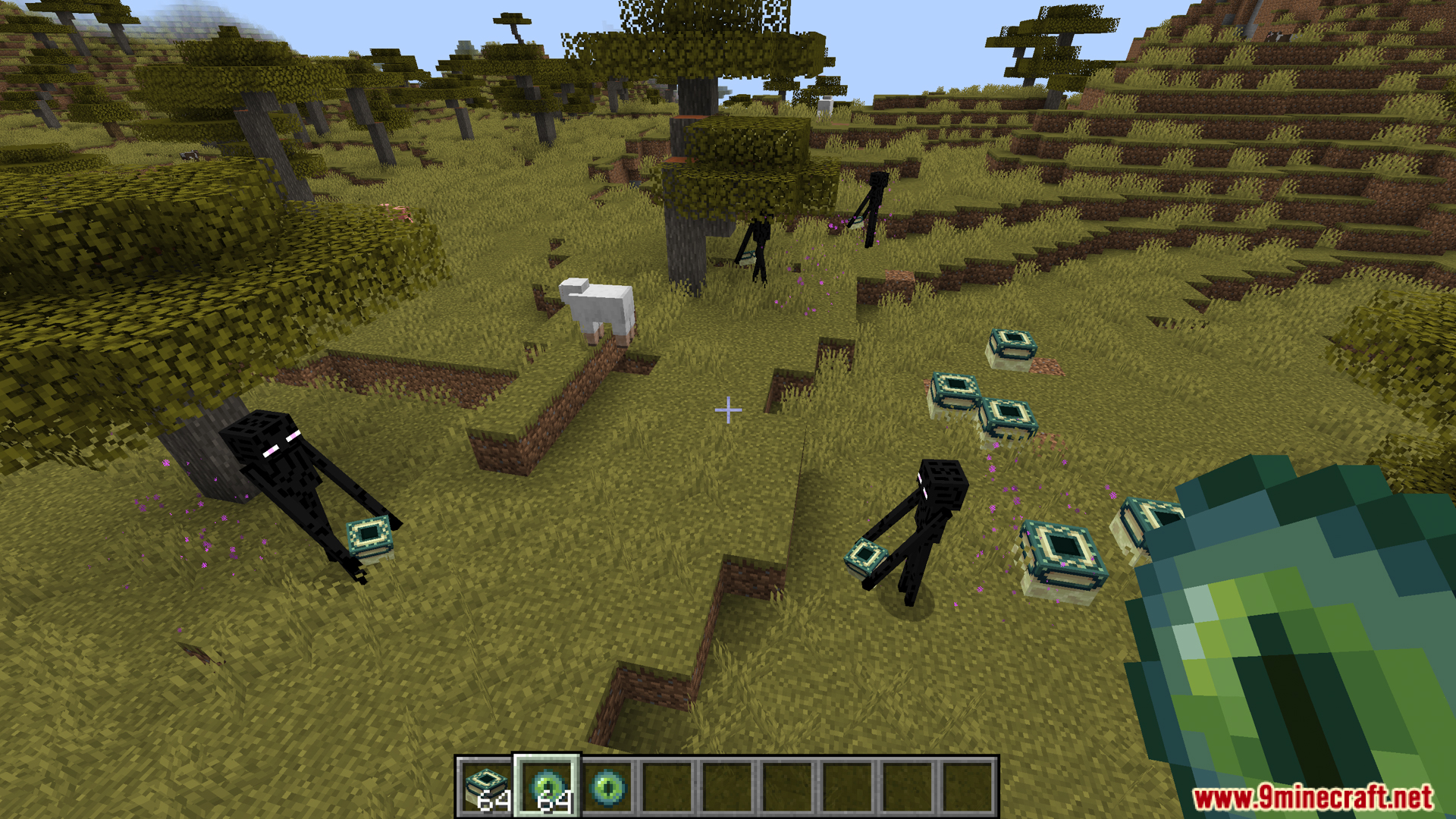 Several Endermen carrying away stolen End Portal Frame blocks