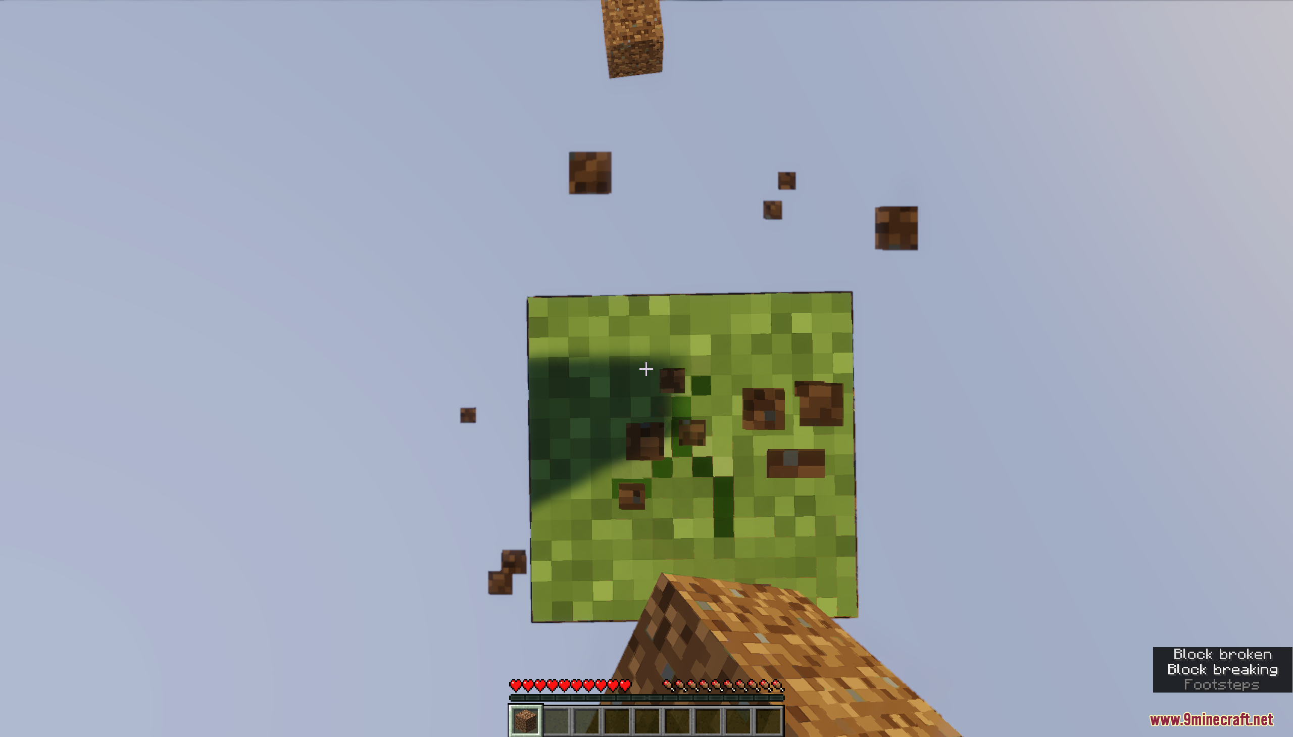 Player breaking the single floating grass block to gather dirt