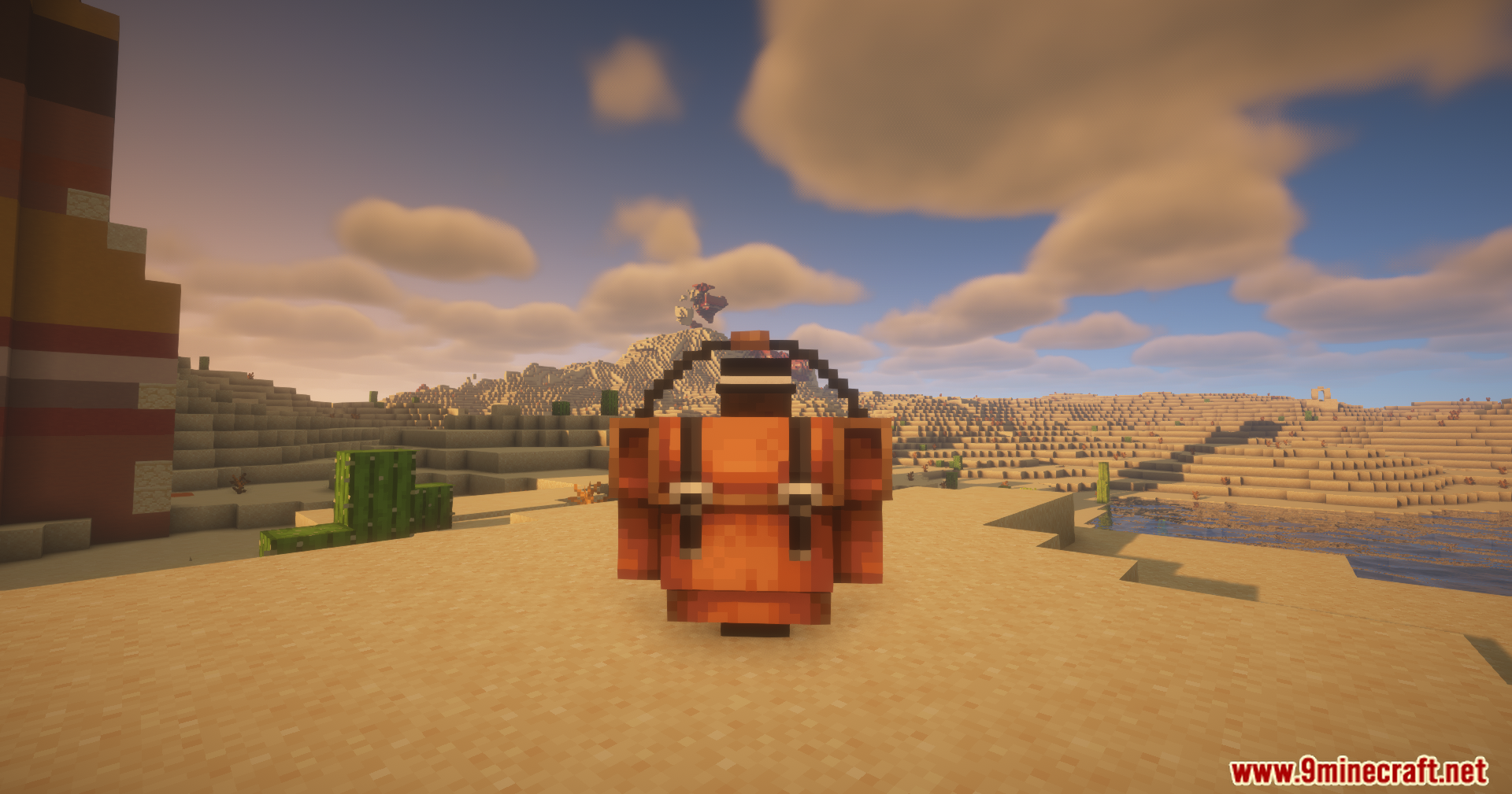 Player wearing a large orange backpack in the desert