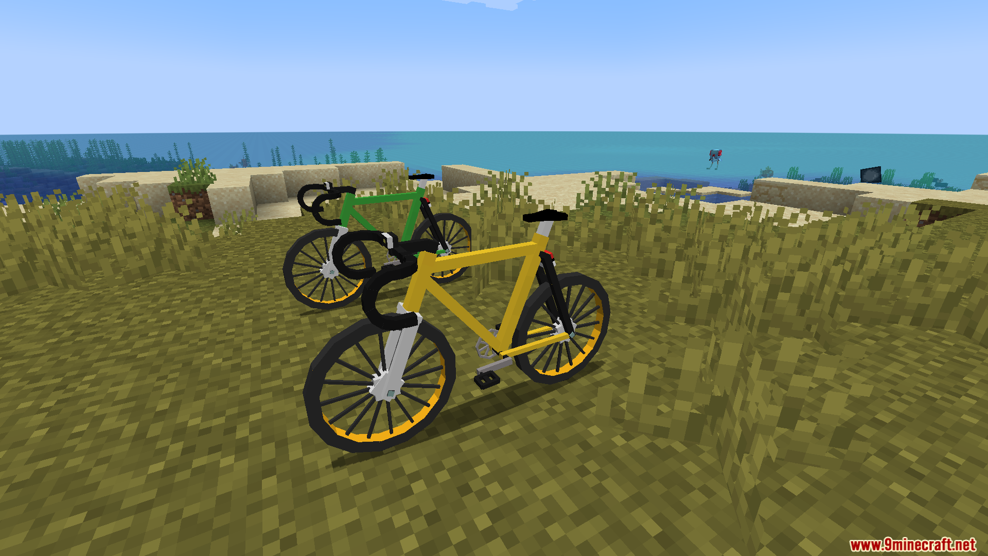 Yellow and green bicycles on a grassy hill