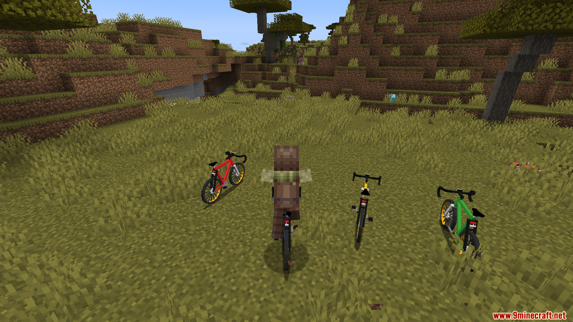 Player riding a bike with others parked nearby