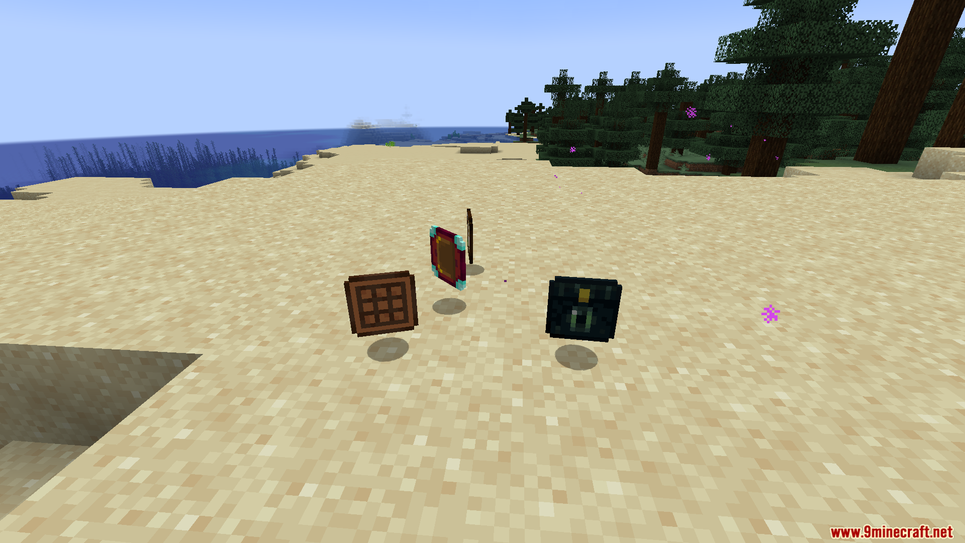 Various tablet items from Portable Tablets Mod dropped on sand
