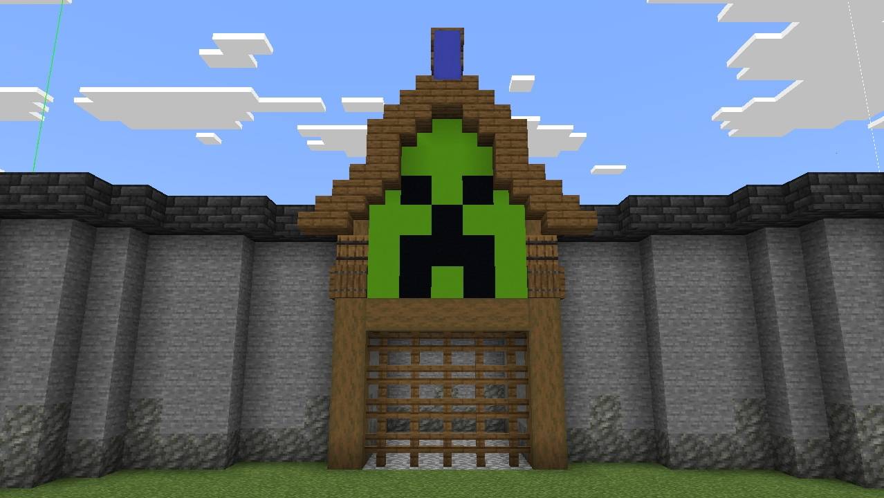 Large curved stone arena wall with a creeper face entrance gate