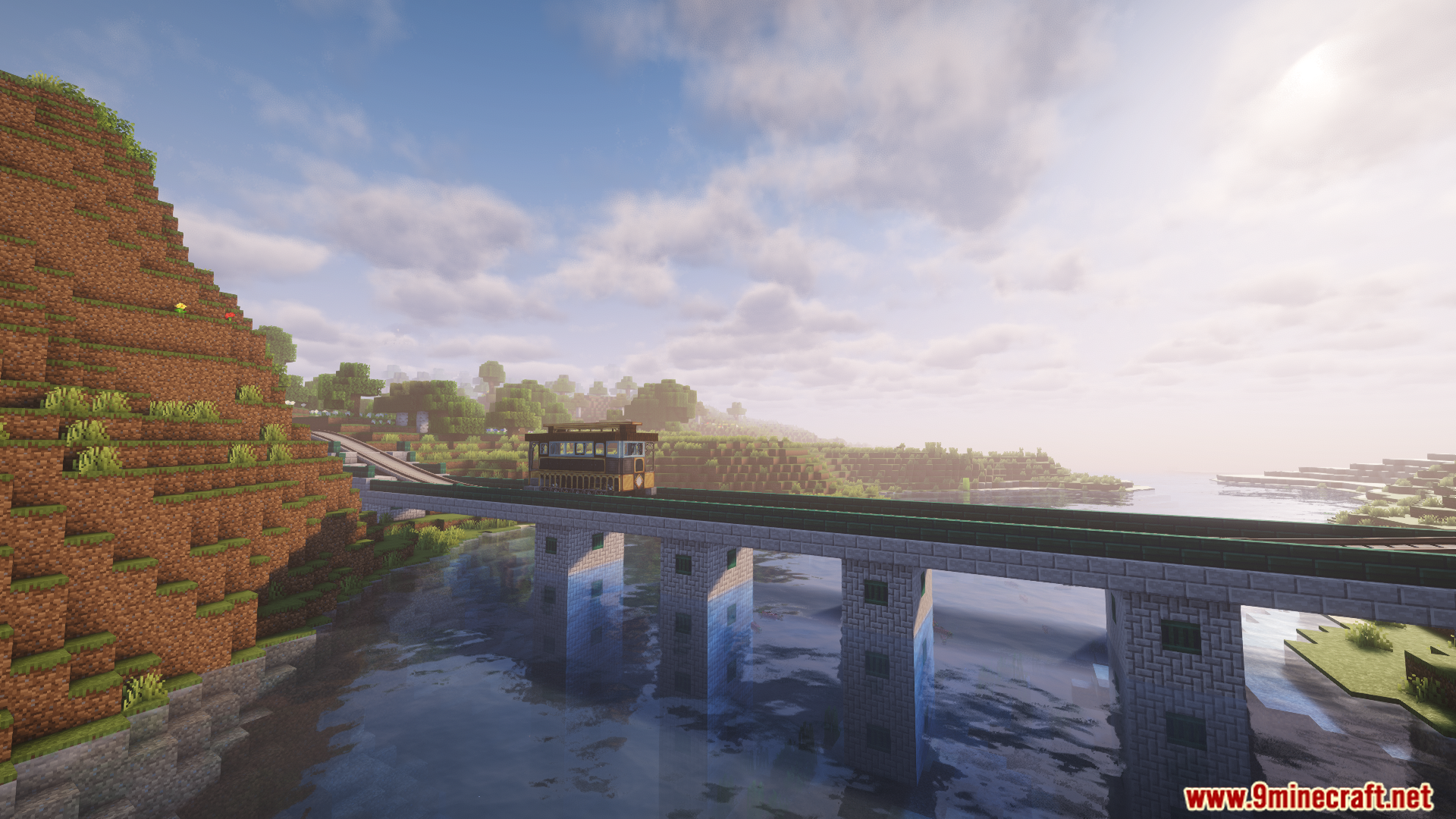 A custom tram crossing a stone bridge over a river