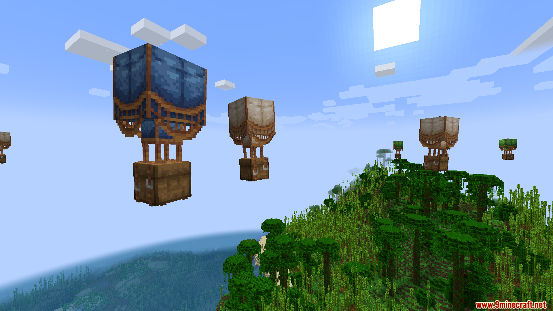 Multiple colorful loot balloons drifting across the blue sky