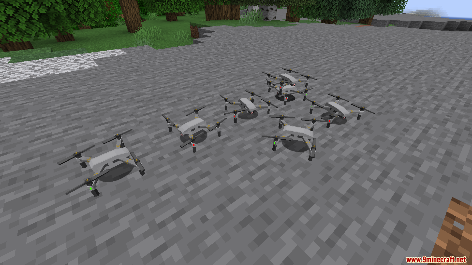 Several drones from Superb Warfare mod placed on the ground