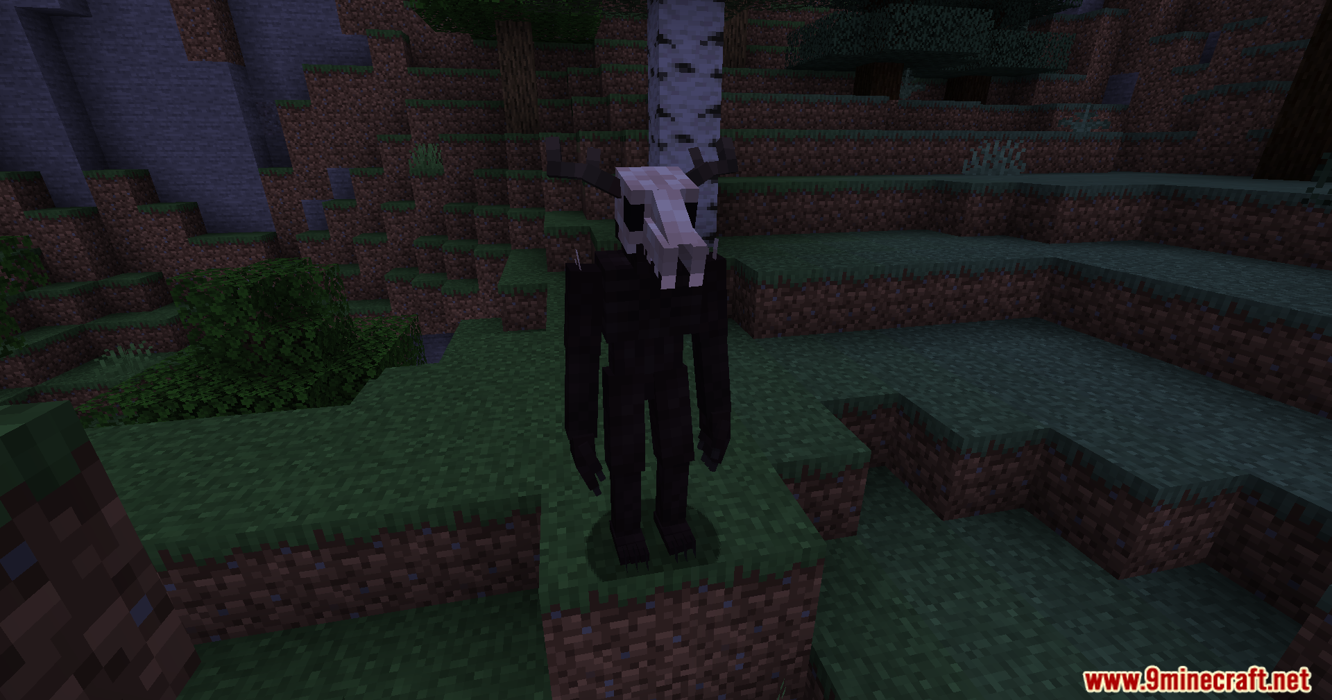 The Wendigo creature stands on a grassy hill