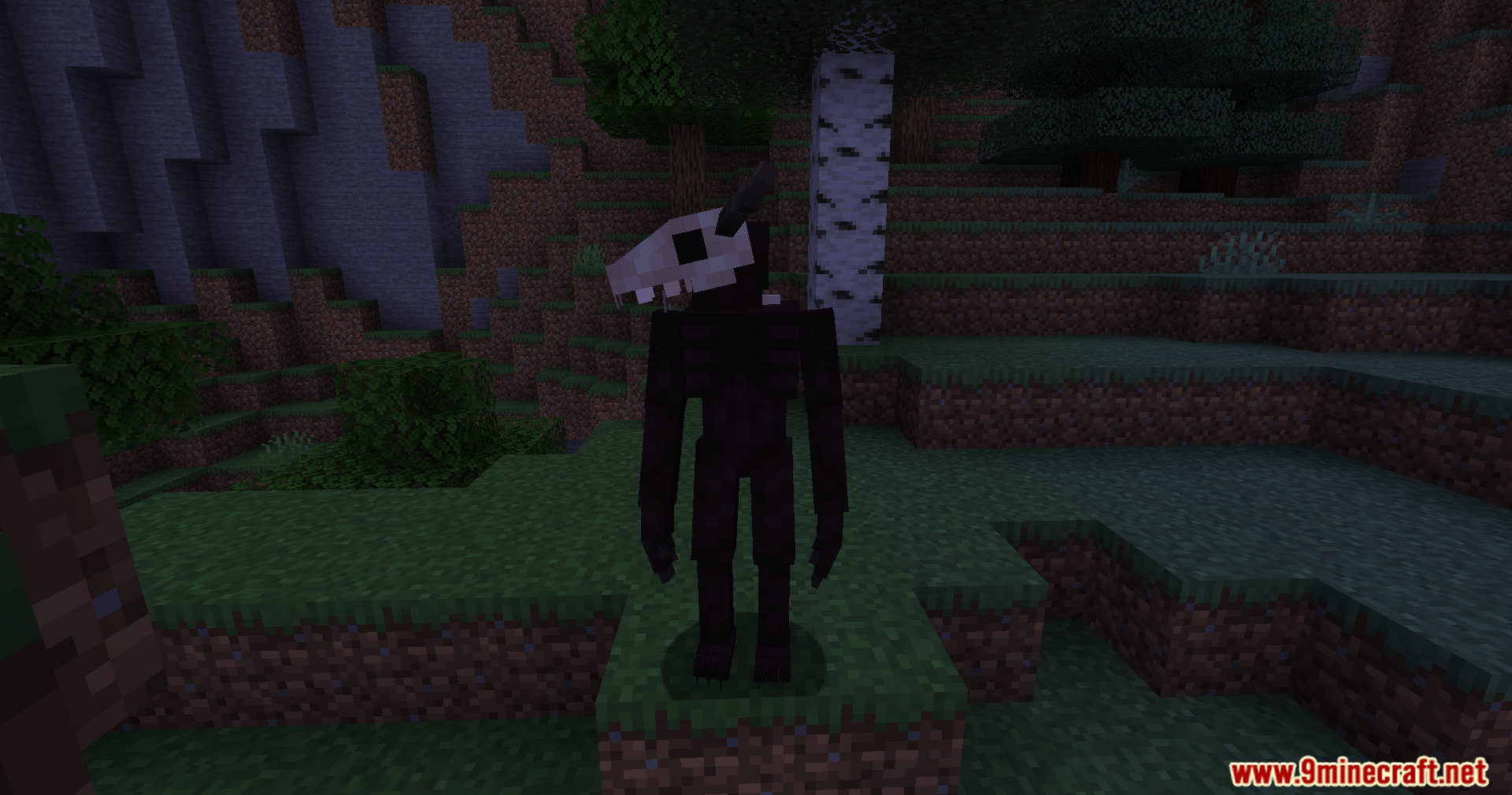 A full body view of the skull-headed monster