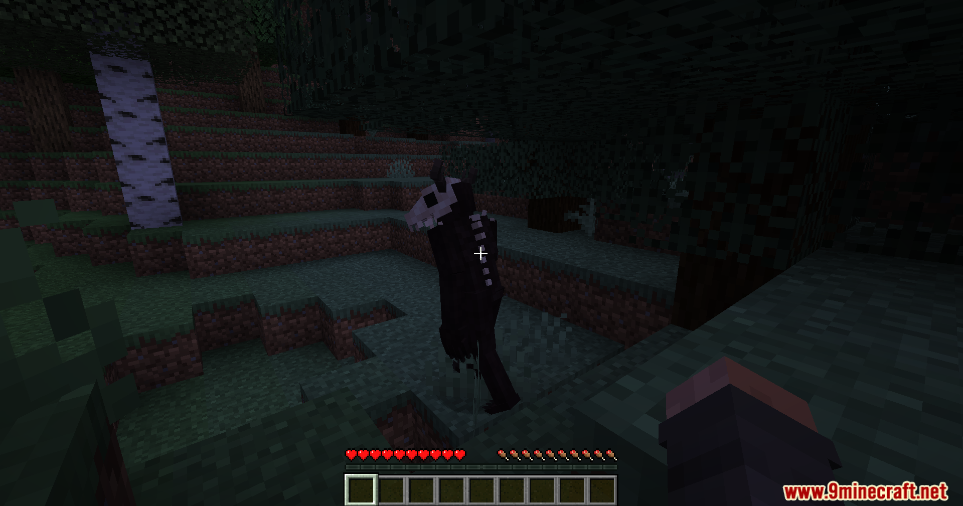 The terrifying Wendigo monster stands among the trees