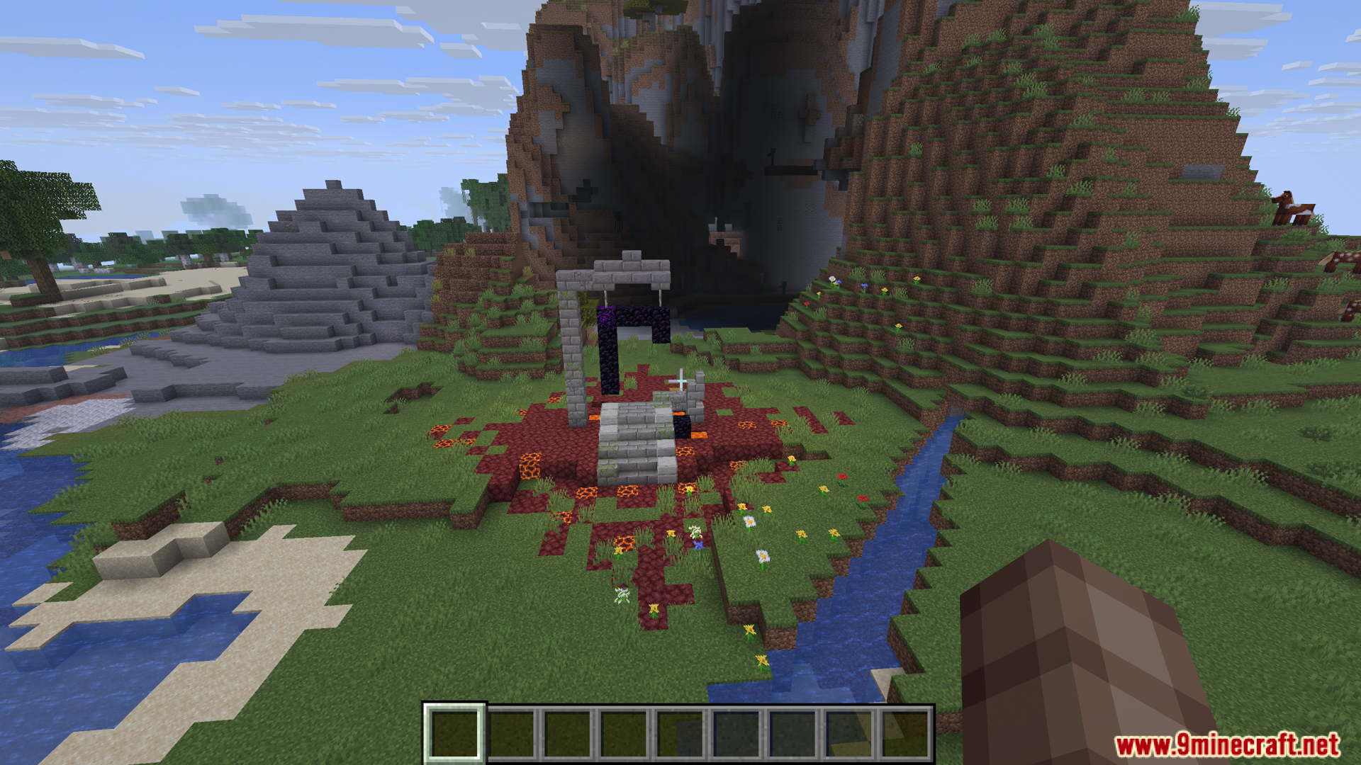 A ruined Nether portal in a grassy plains biome
