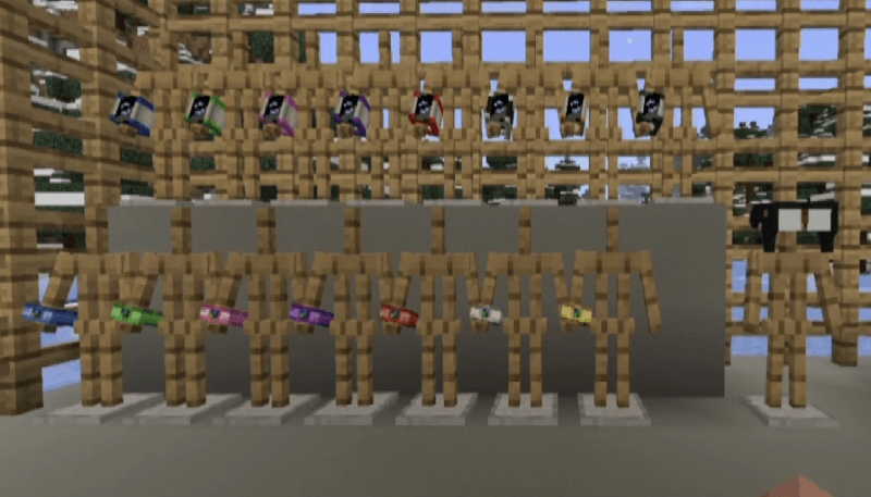 Collection of dyed Rotom phones displayed on wooden armor stands