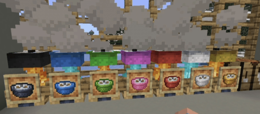 Row of colorful cooking pots over campfires making edible dyes