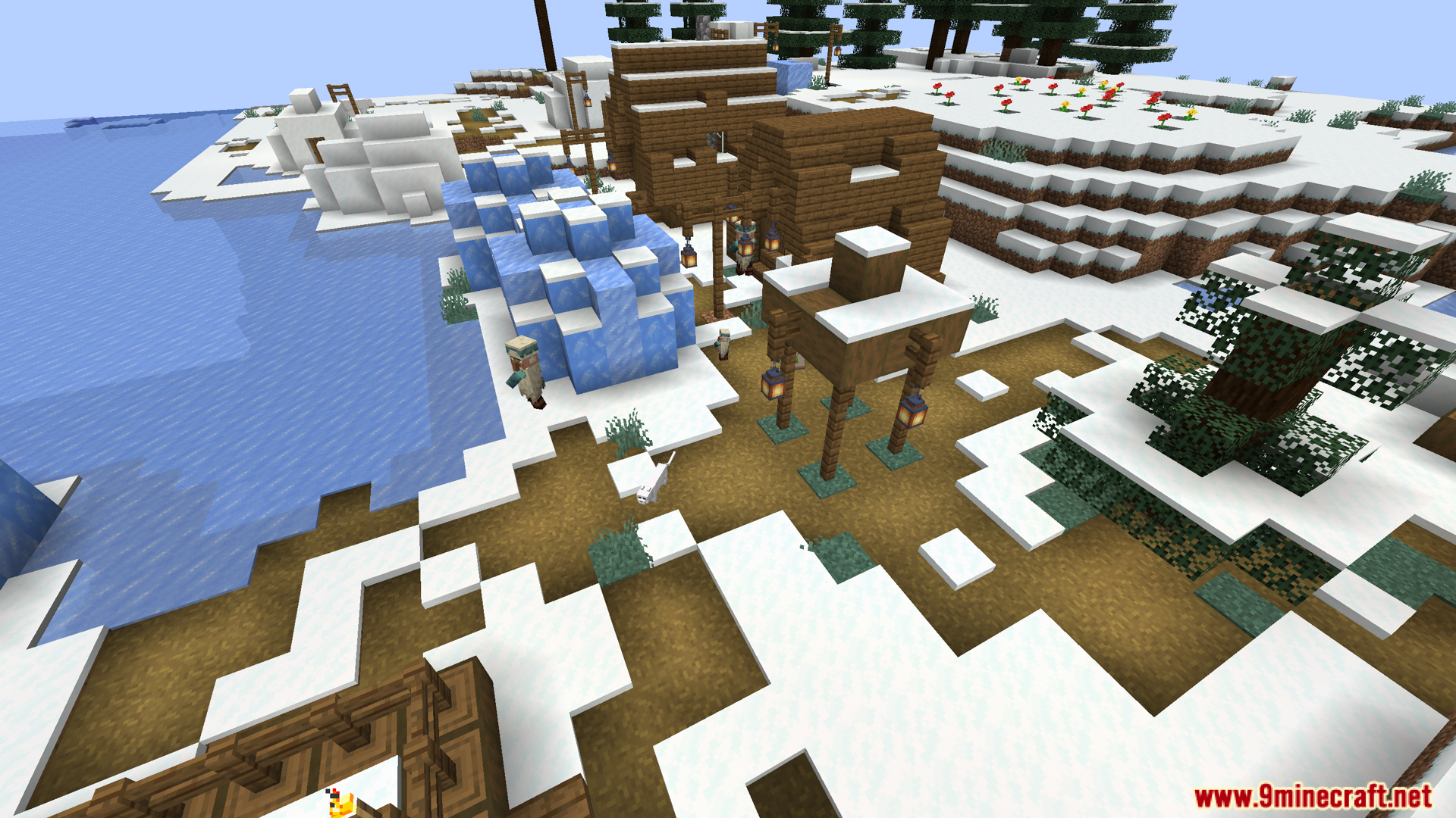 A snowy village with wooden houses and igloos by water