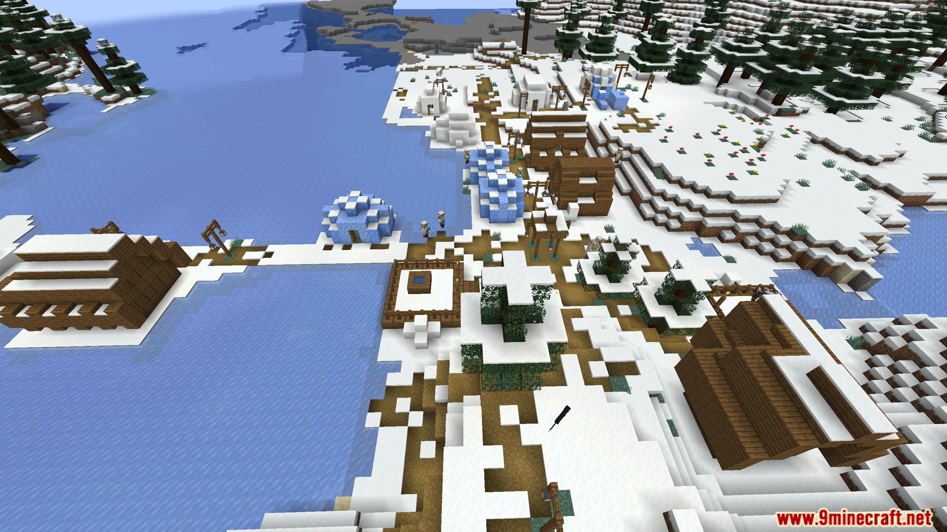 An aerial view of a snowy village with igloos