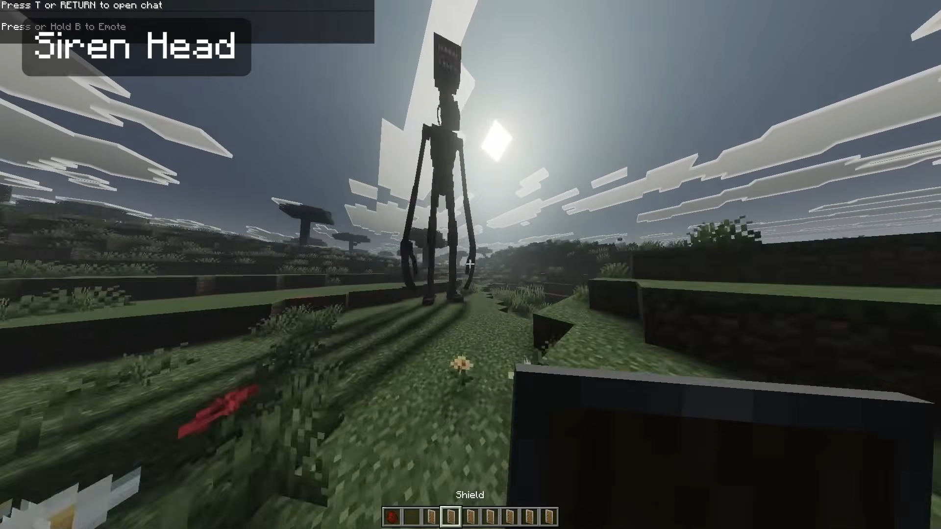 Player looking at giant Siren Head monster in a grassy plain