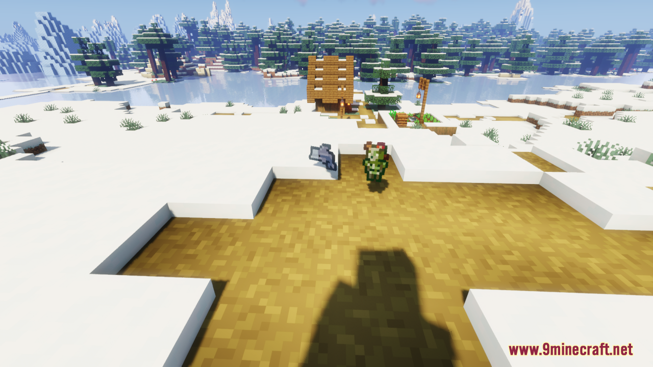 Player holding a tiny phantom spawn egg near a snowy wooden house