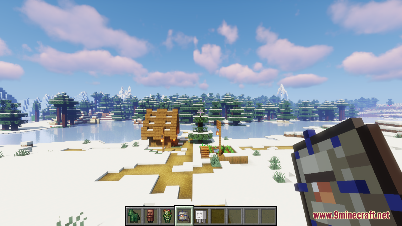 Player holding a tiny pillager spawn egg in a snowy winter landscape