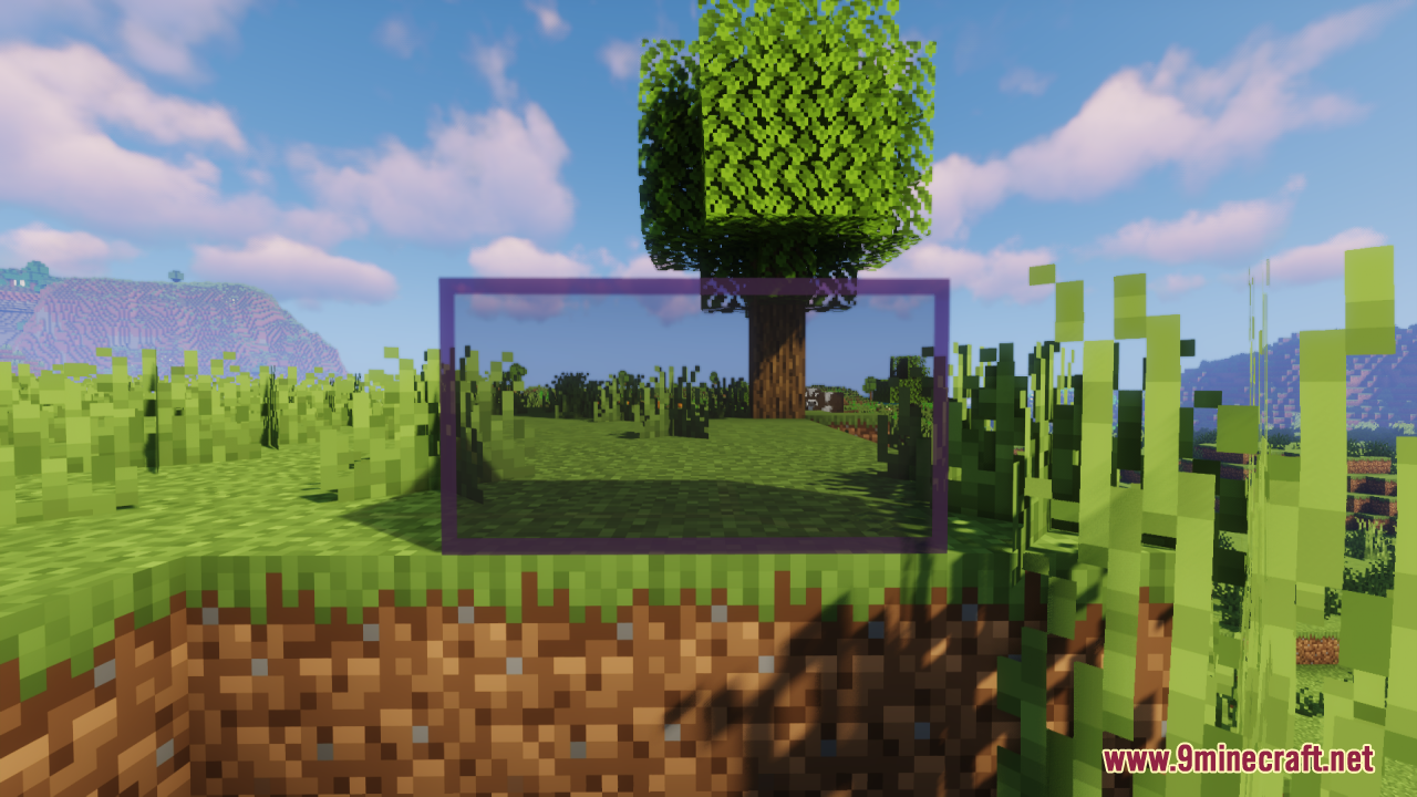 Connected clear glass blocks placed next to a dirt hill