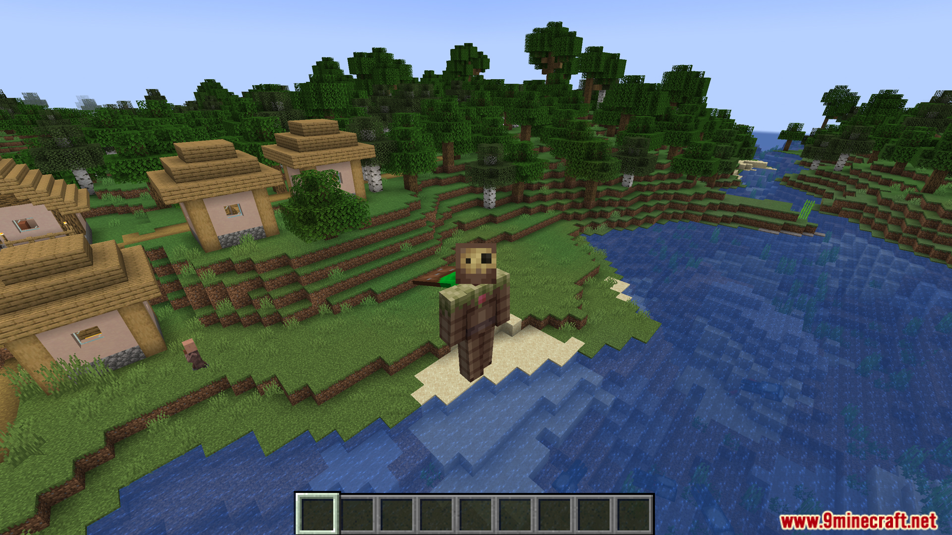 Player wearing unique armor stands by a village