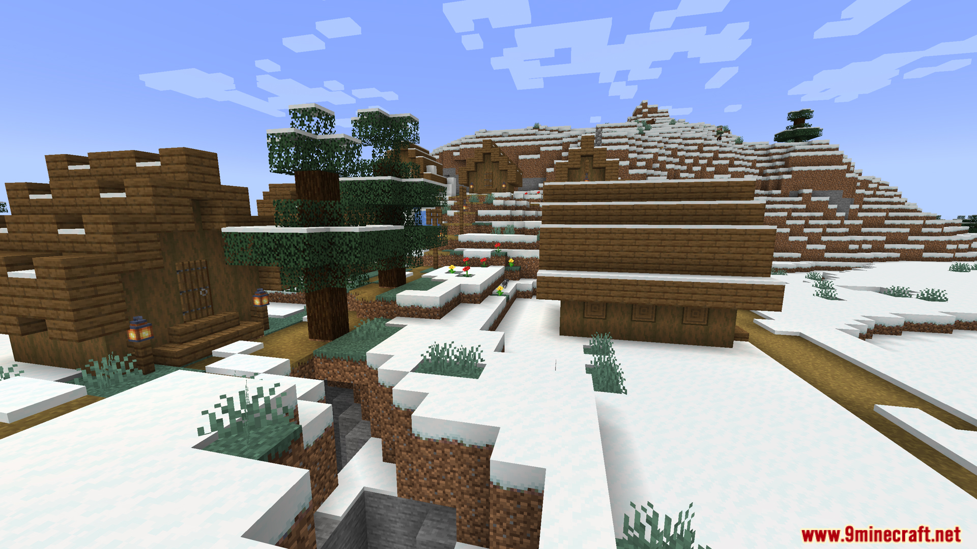 Wooden houses and trees in a snowy mountain village