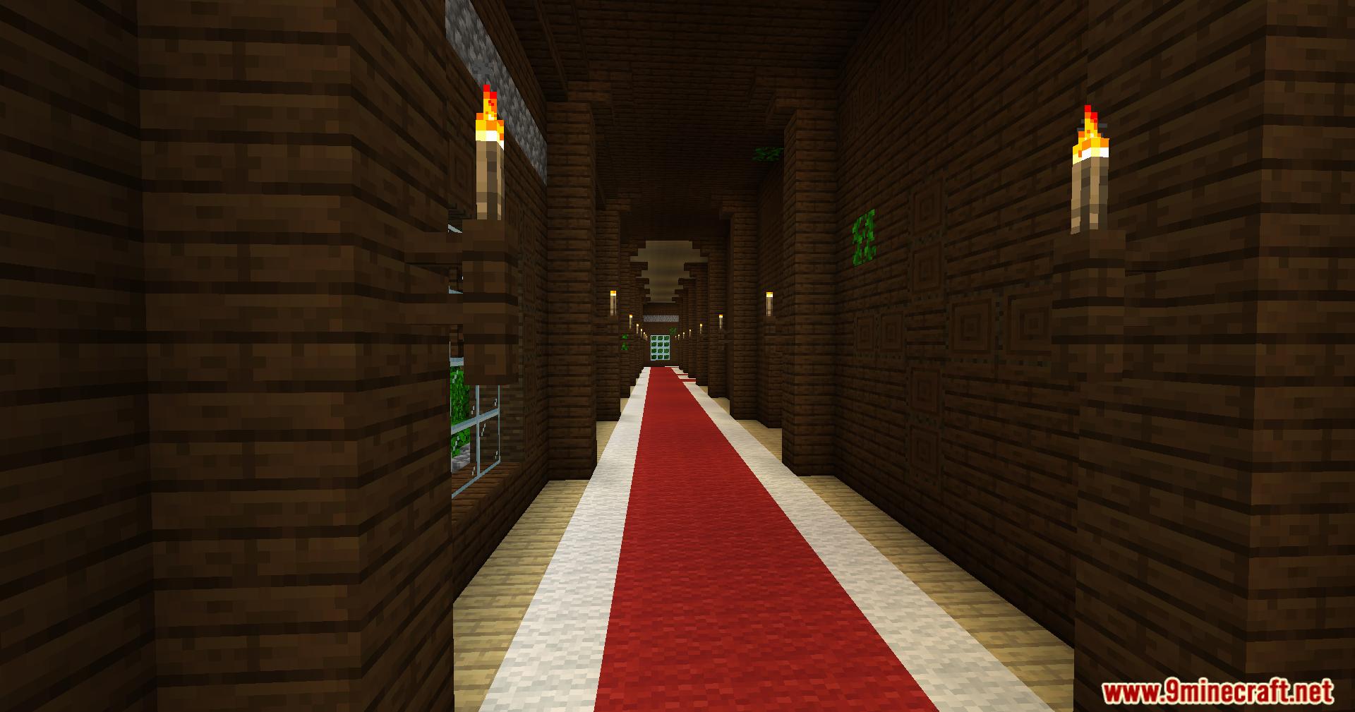 Long wooden hallway with red carpet inside a woodland mansion