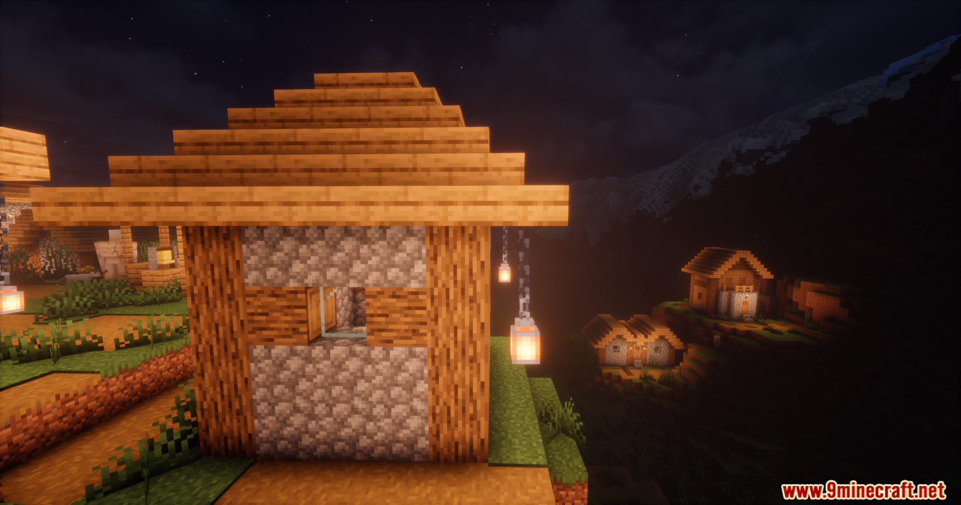 A close-up of a rustic house with a swaying lantern