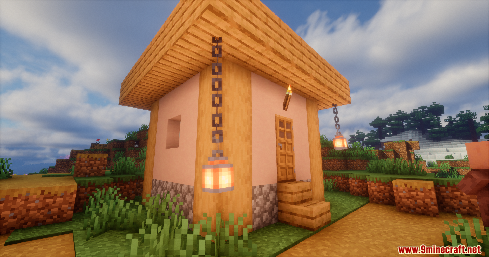 A lantern hanging from the corner of a house