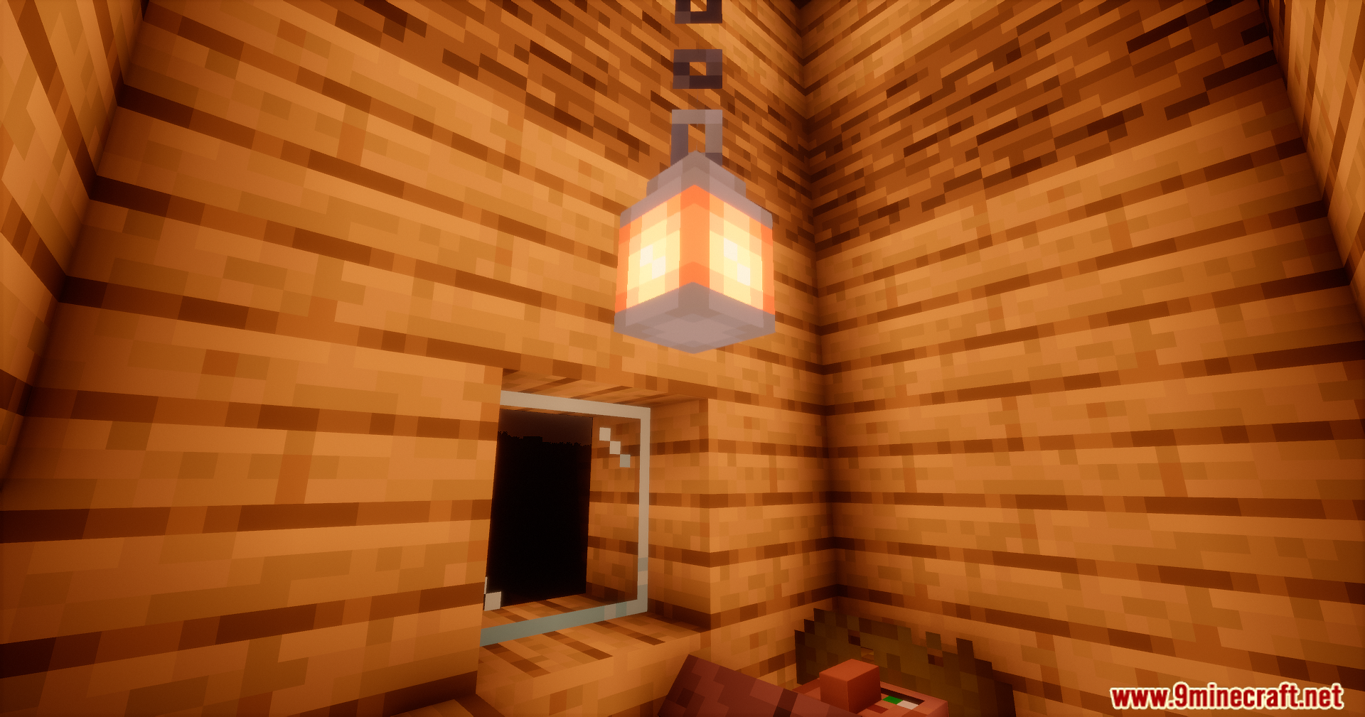 A single lantern hanging from a wooden ceiling indoors