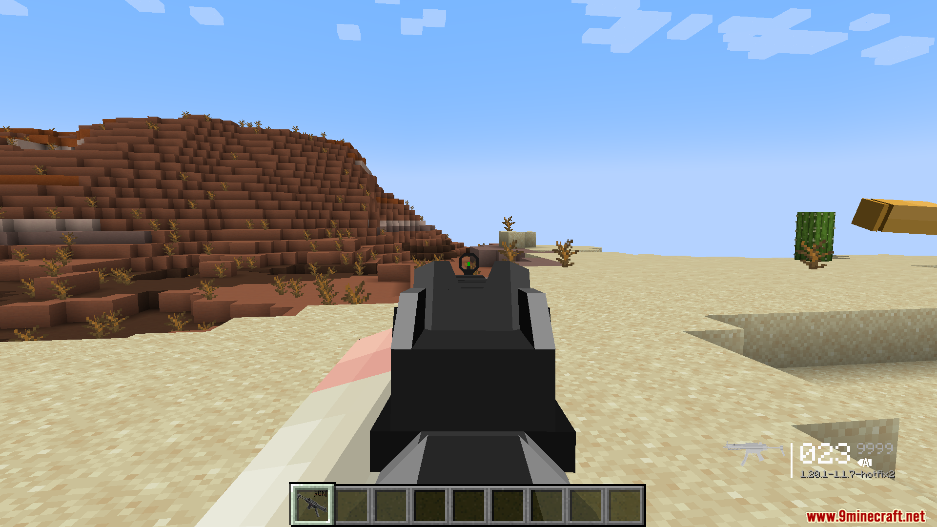 Player aiming a submachine gun in desert using the TaCZ mod