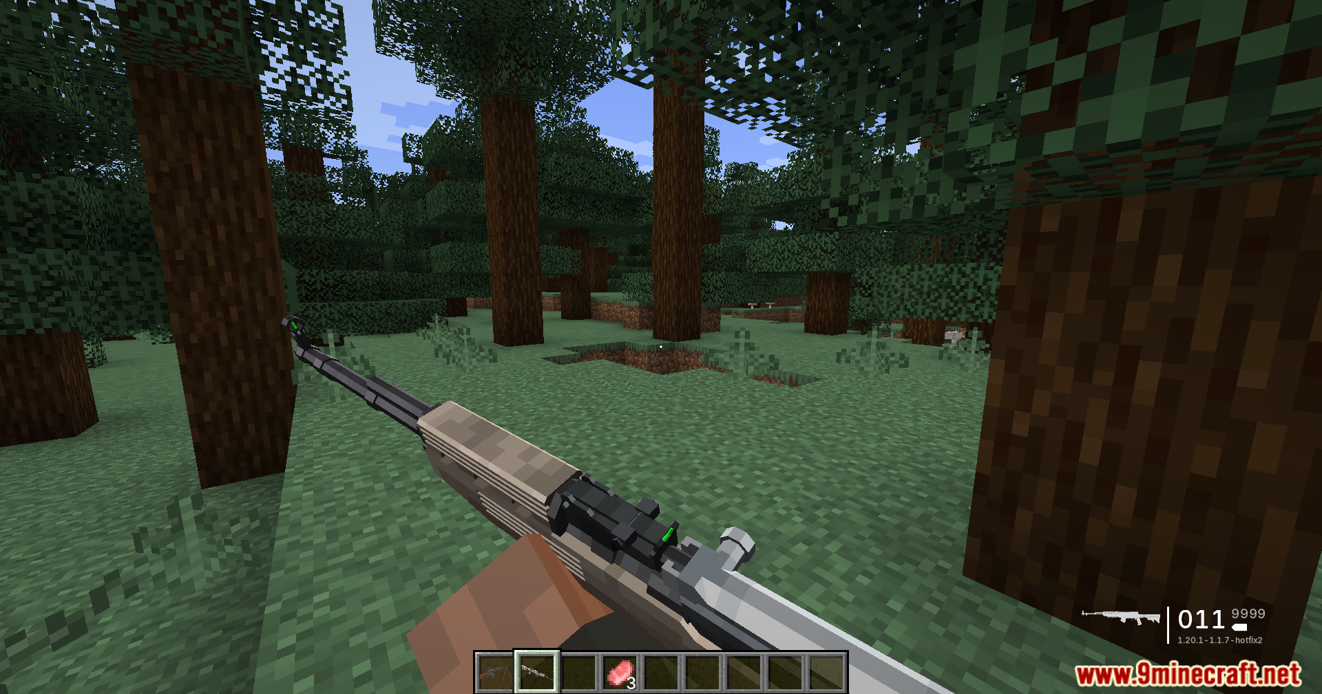 First person perspective of holding a rifle in a forest biome