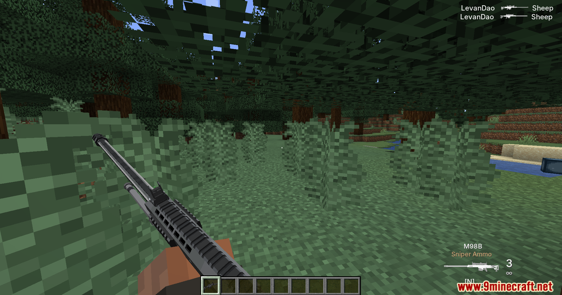 Player holding a TaCZ sniper rifle in a forest biome