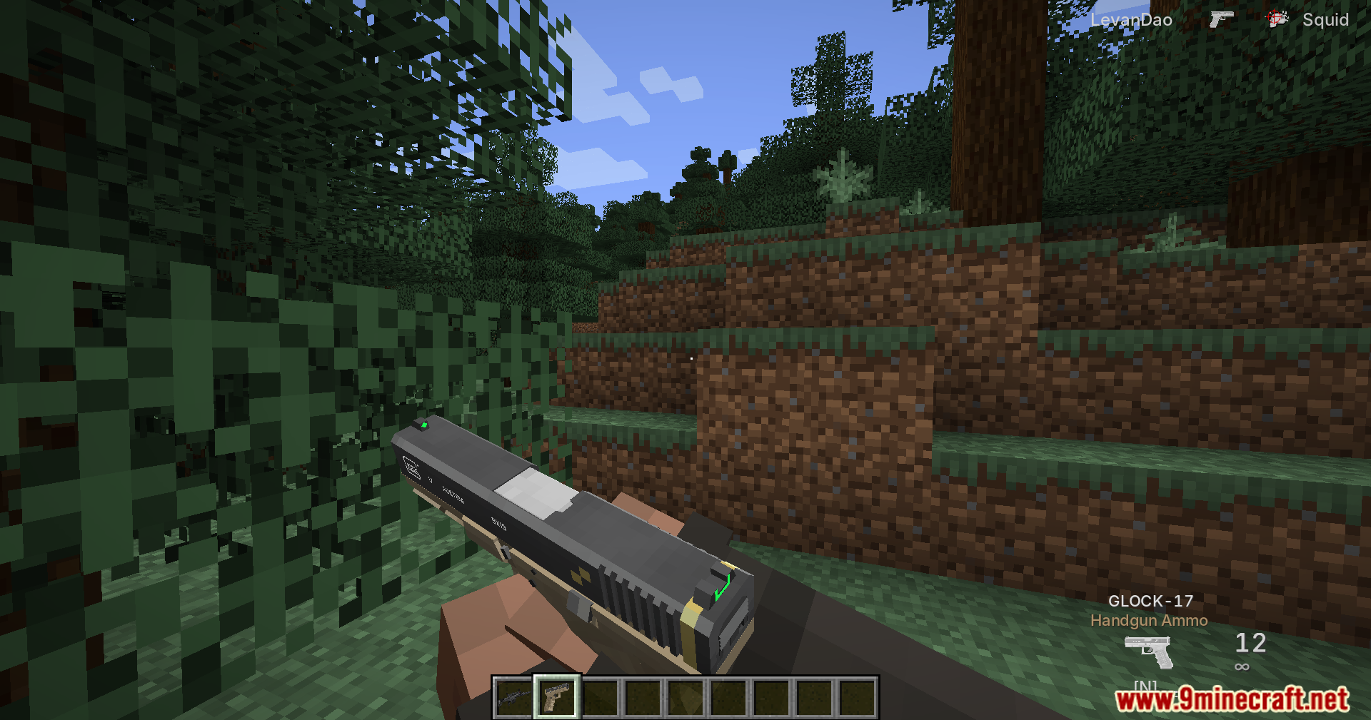 Player holding a Glock 17 handgun in a Minecraft forest biome